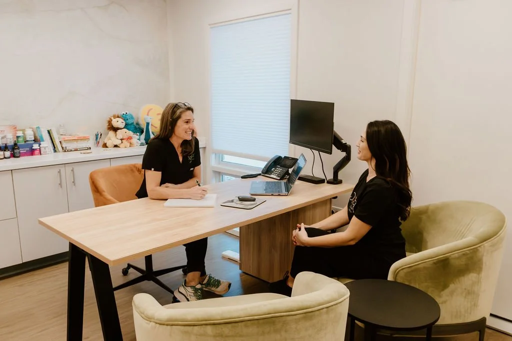 Kristie discussing personalized health goals with a Foundational Wellness Membership client in Greenwood, Indiana.