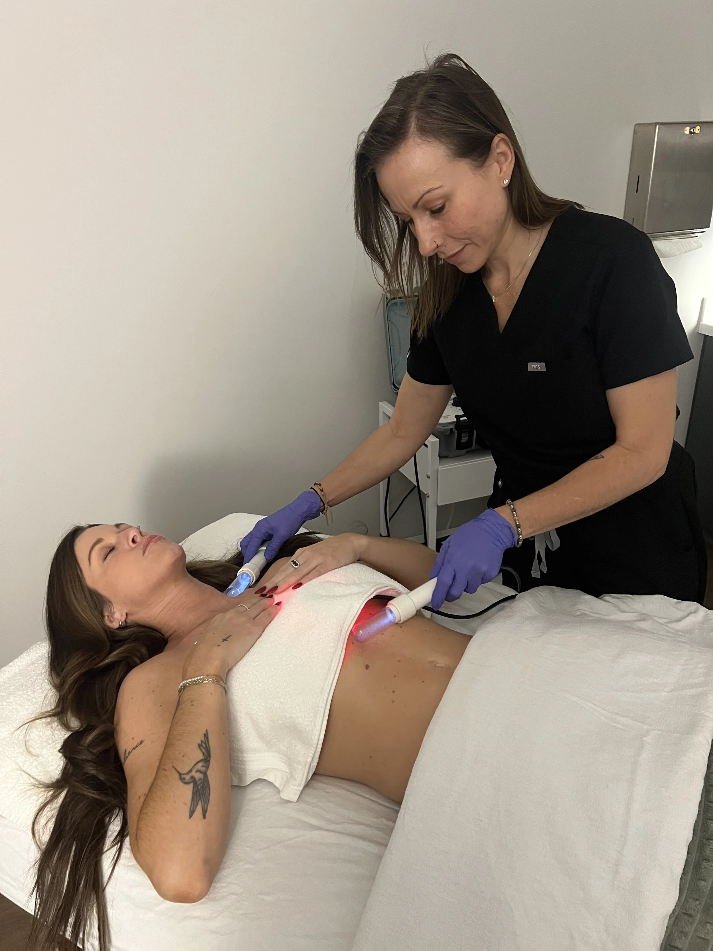 Therapist providing Lymphatic Enhancement Therapy for a Total Wellness Membership client in Greenwood, Indiana.