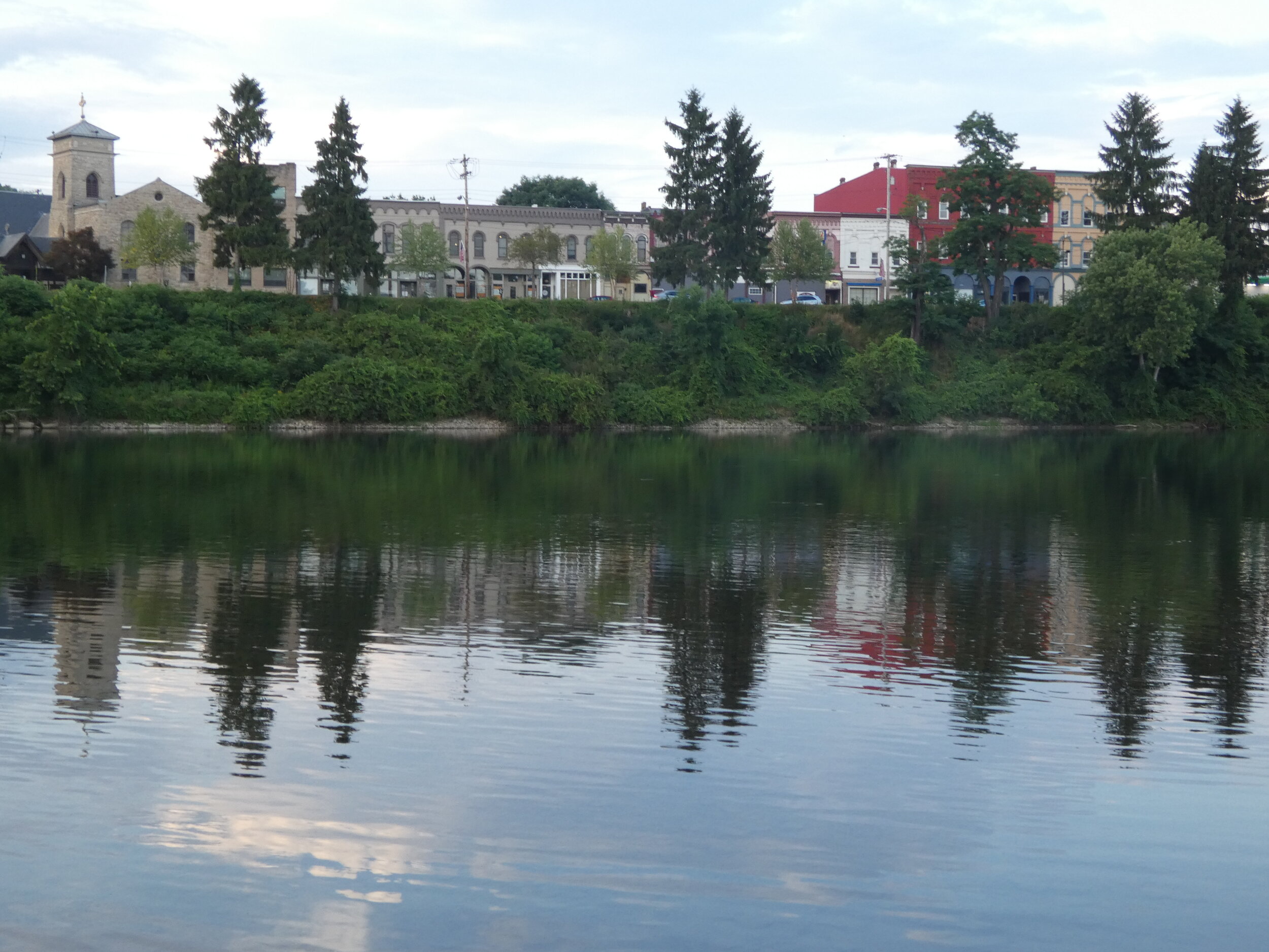 Buildings crowding the river in Warren, PA.
