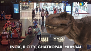 Visitors Pose with Giant 3D T-Rex – Before Watching a Movie at INOX Cinemas  – INDE