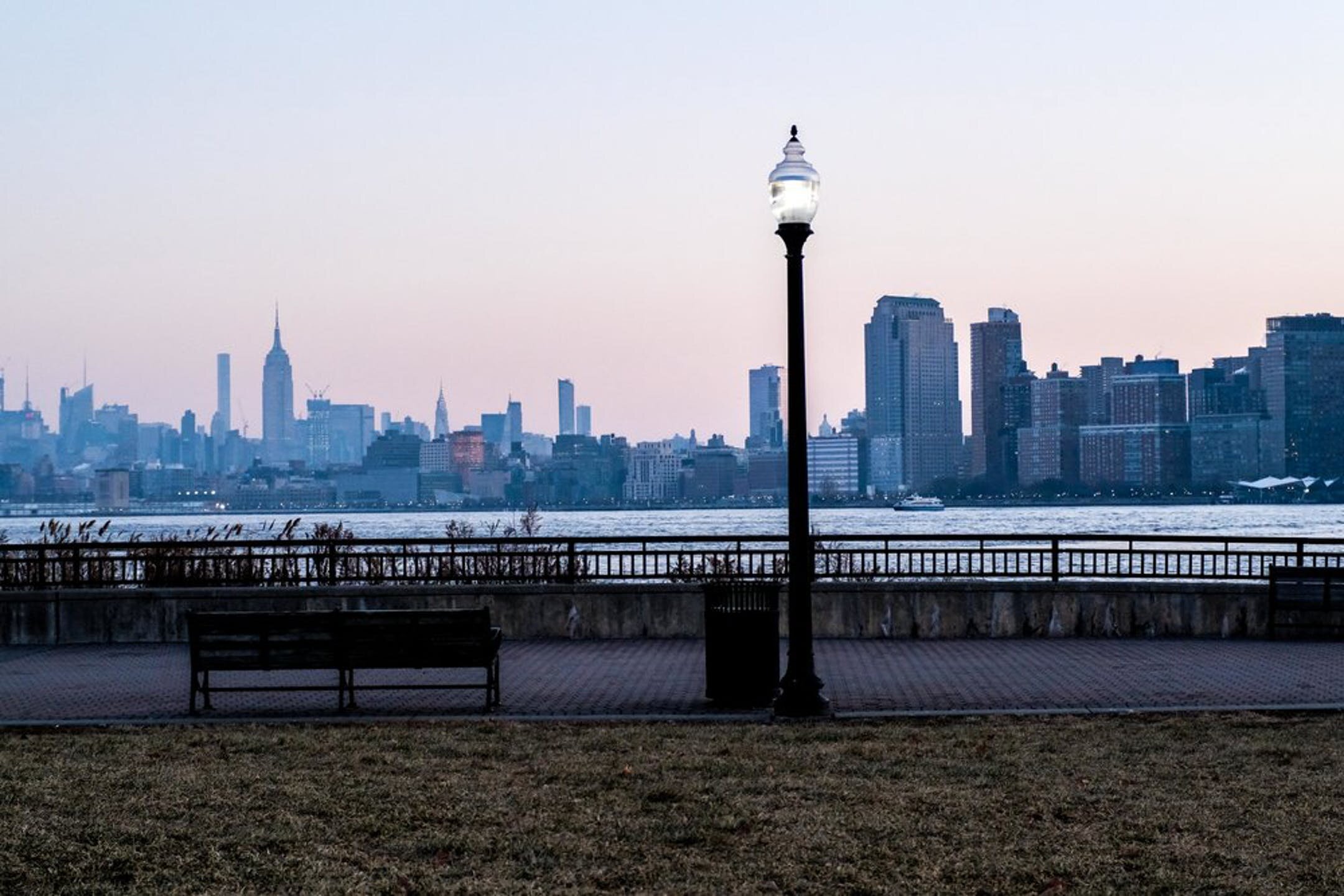Statue of woman's head in Jersey City seen from Hudson River