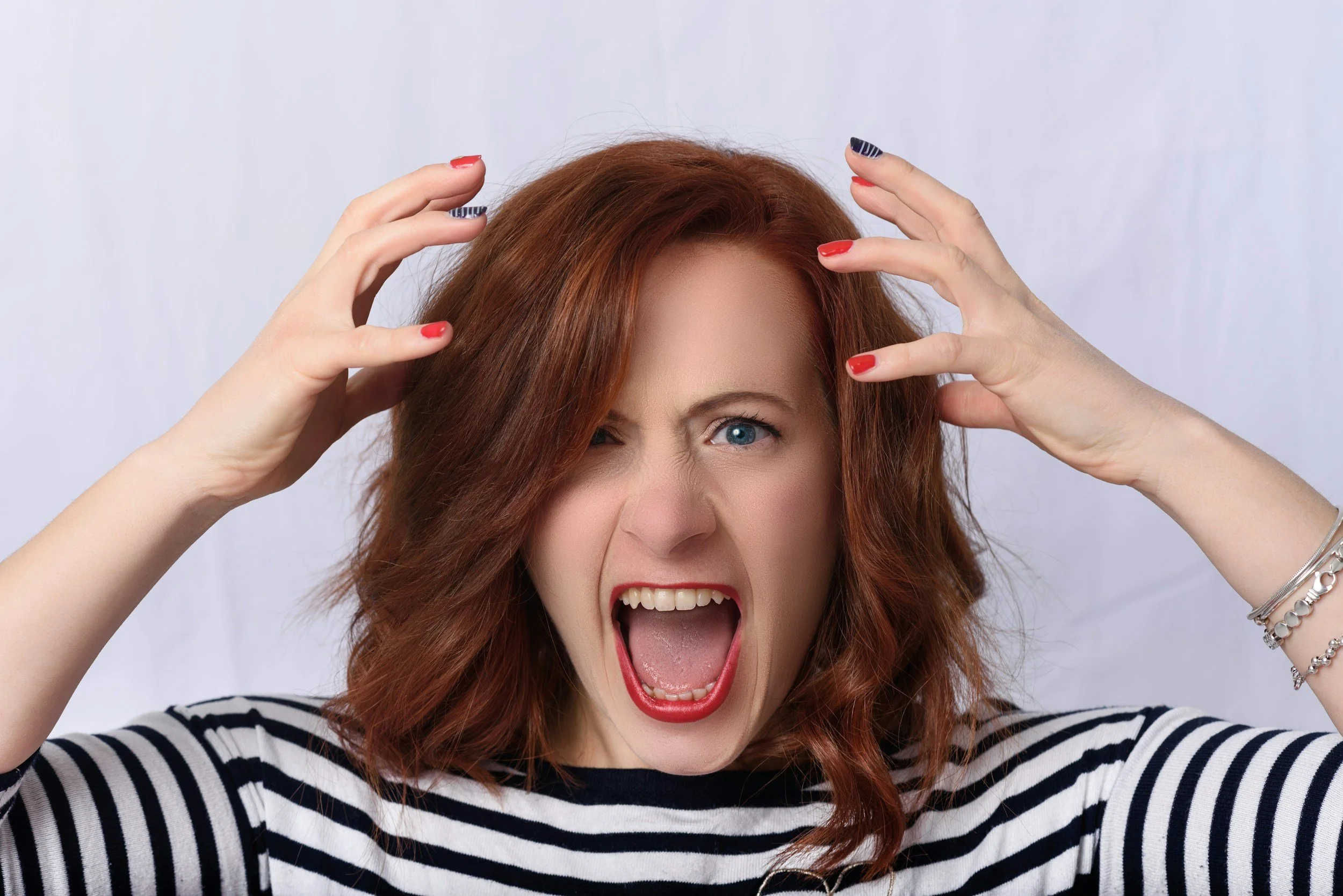 a woman raising her hands above her head in female rage