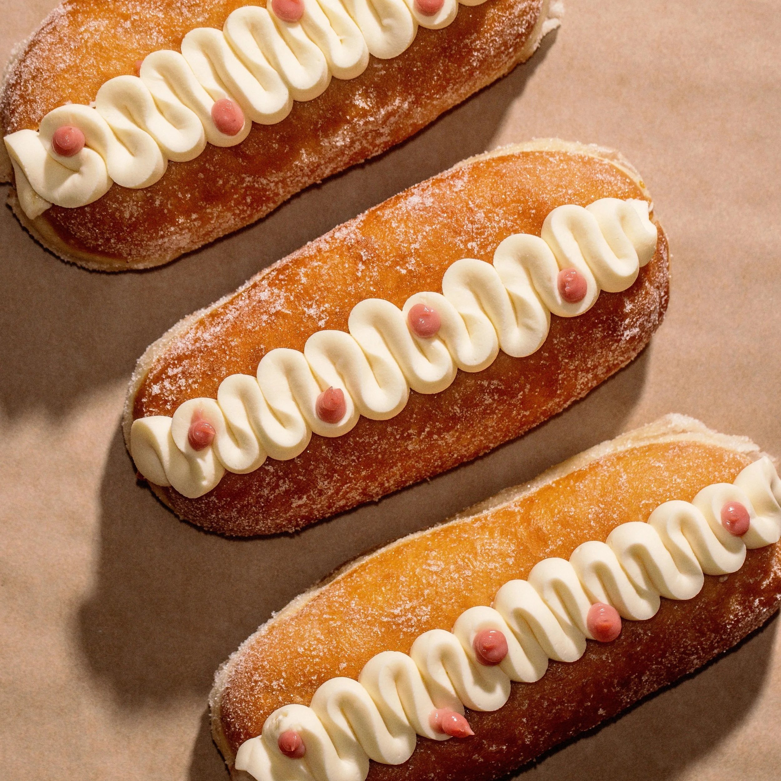 Wildfarmed regenerative flour Long Boys with Raspberry curd, Almond Praline and whipped Valrhona white chocolate namelaka (FRIDAY).