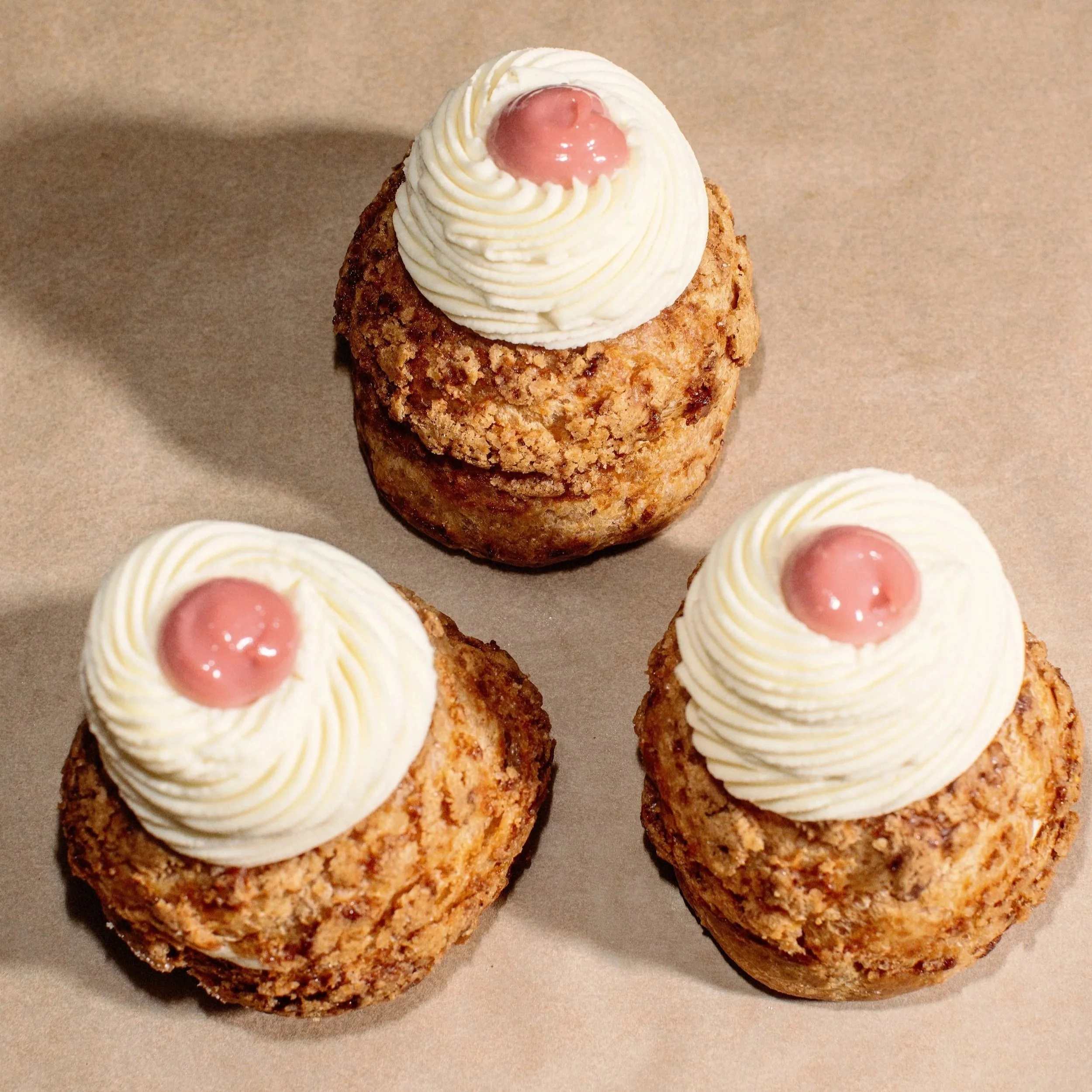 Irish Spelt Flour choux filled with Raspberry curd, amaretto soaked sponge, almond praline and a whipped Valrhona white chocolate namelaka (WEEKEND).