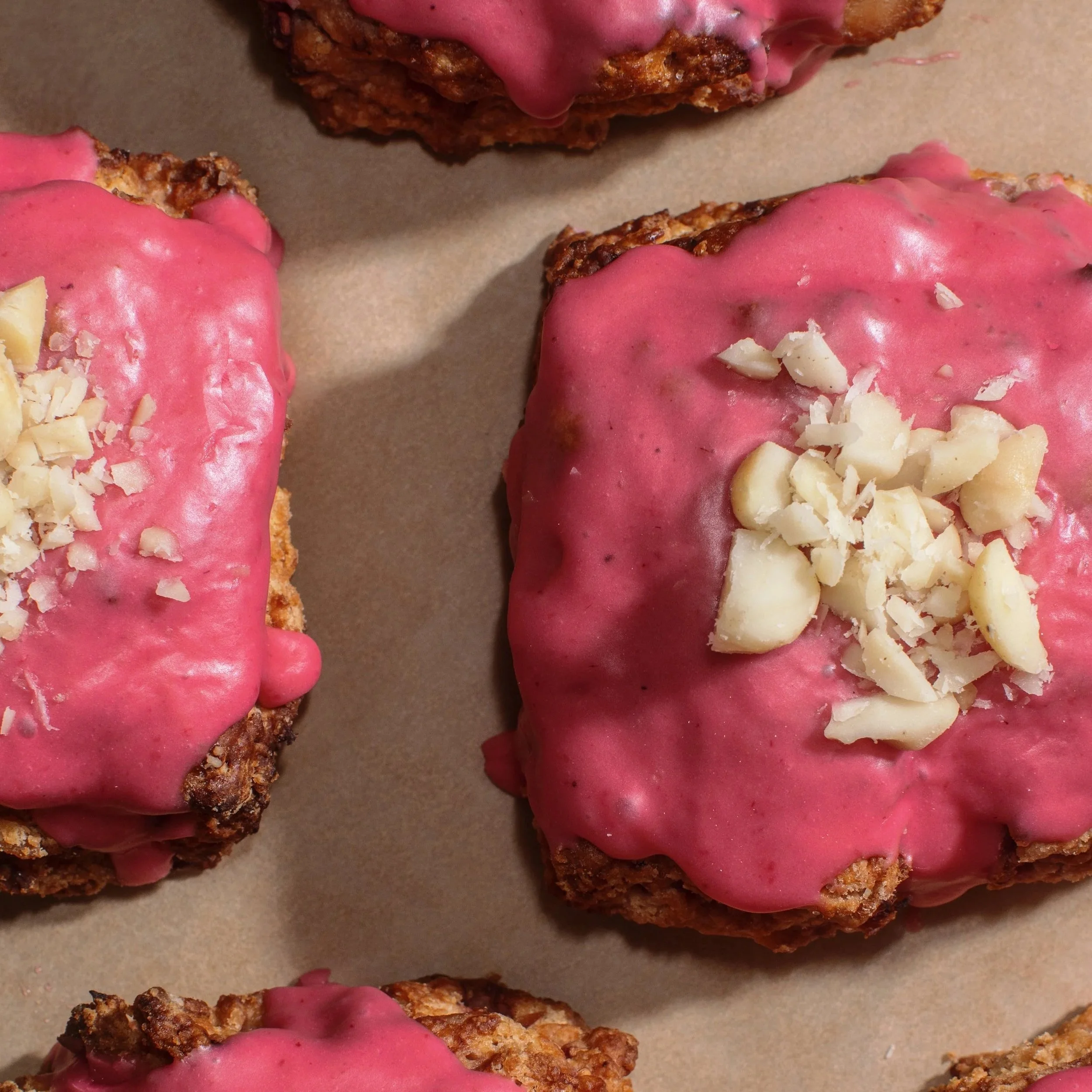 Mana Heritage Mills heritage wheat raspberry macadamia scones, topped with a raspberry glaze (WEEKEND).