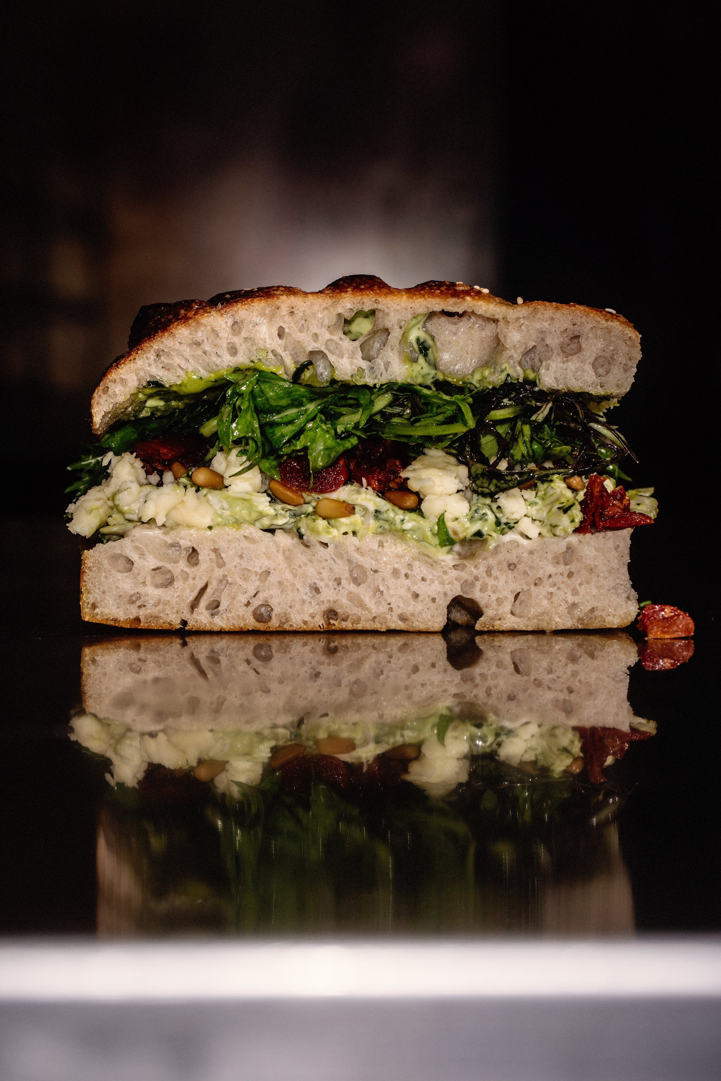 Roasted Chicken & Pesto Focaccia Sando with Sun-Dried tomatoes, toasted pine nuts, McNally Family Farm Leaves and Toonsbridge Fior De Latte from Cork