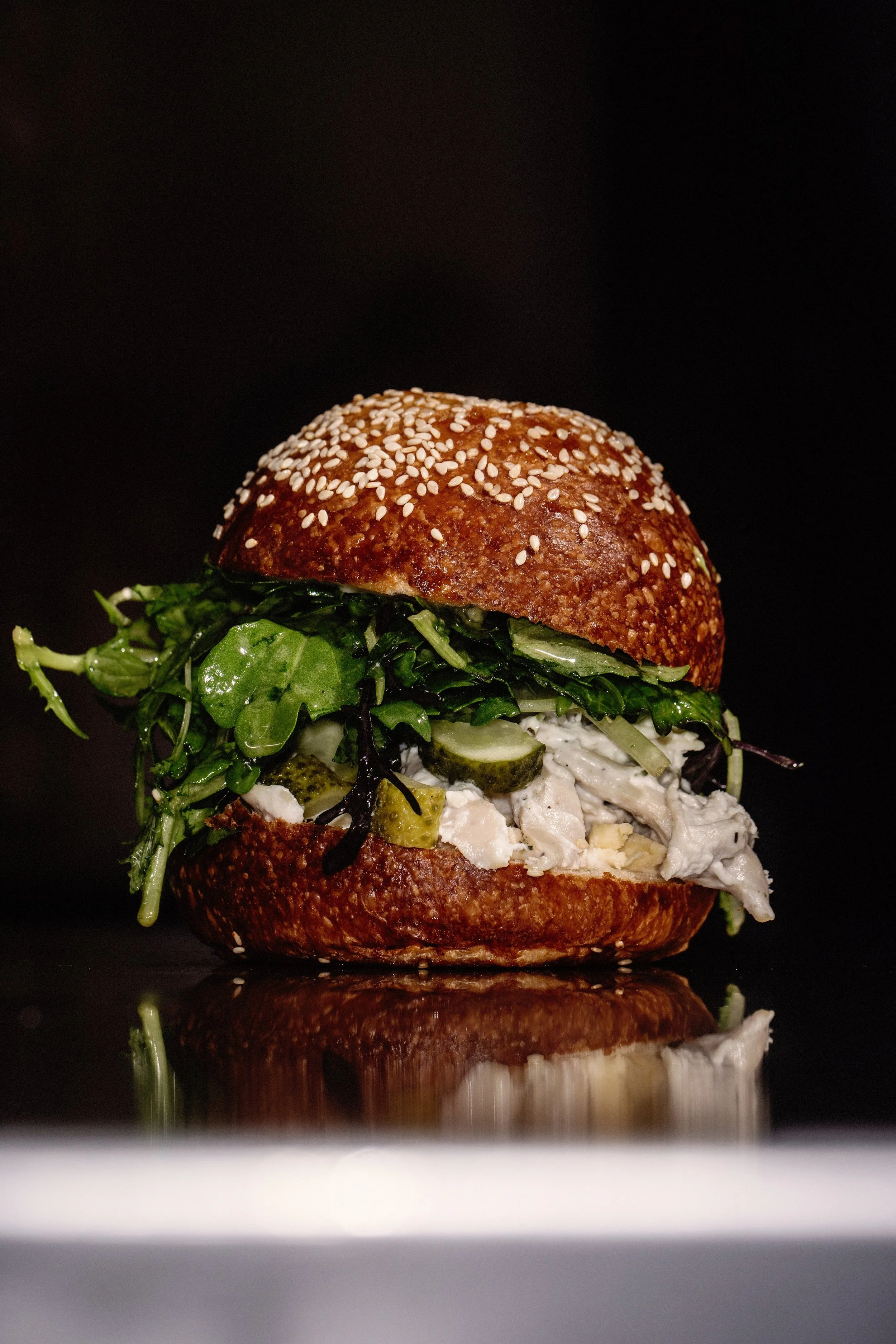 Roast Chicken & Ranch Bap with Young buck, McNally Family Farm leaves and gherkins.