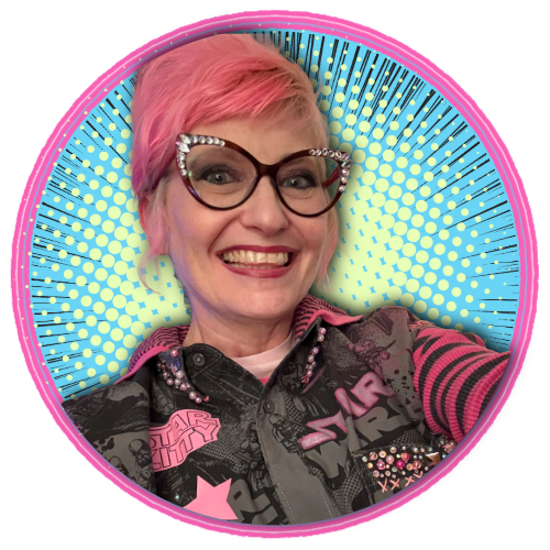 A woman with pink hair and glasses smiling for a selfie, wearing a Star Wars jacket and standing in front of a colorful, comic book style background.