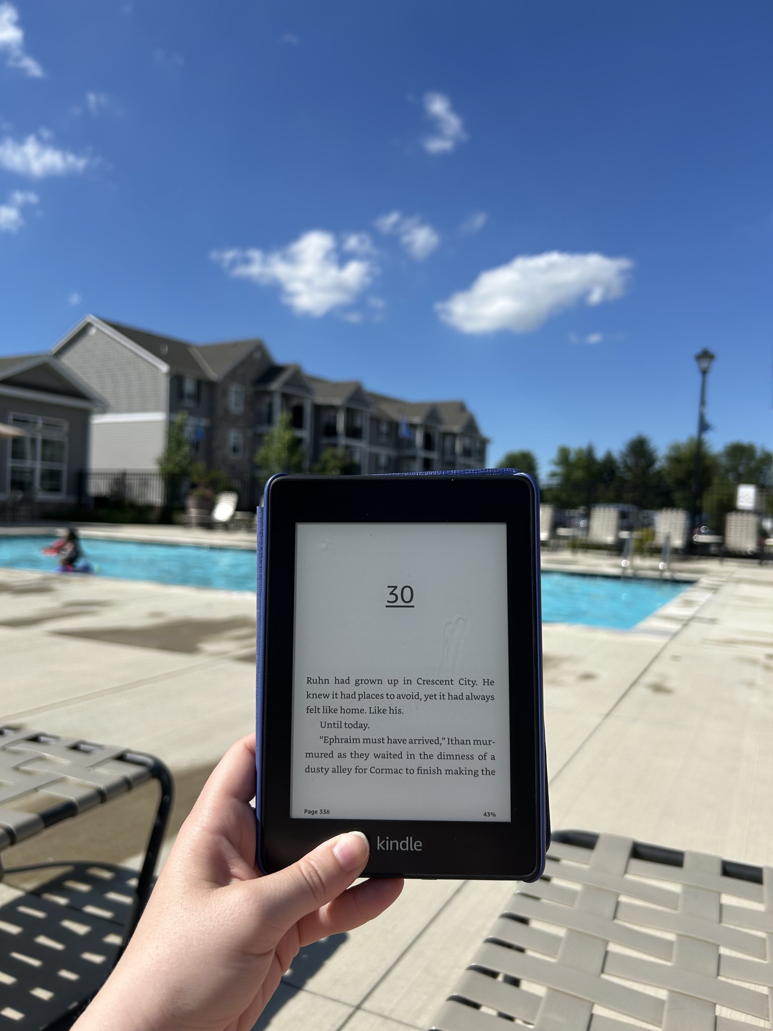 A photo of a kindle in front of a pool