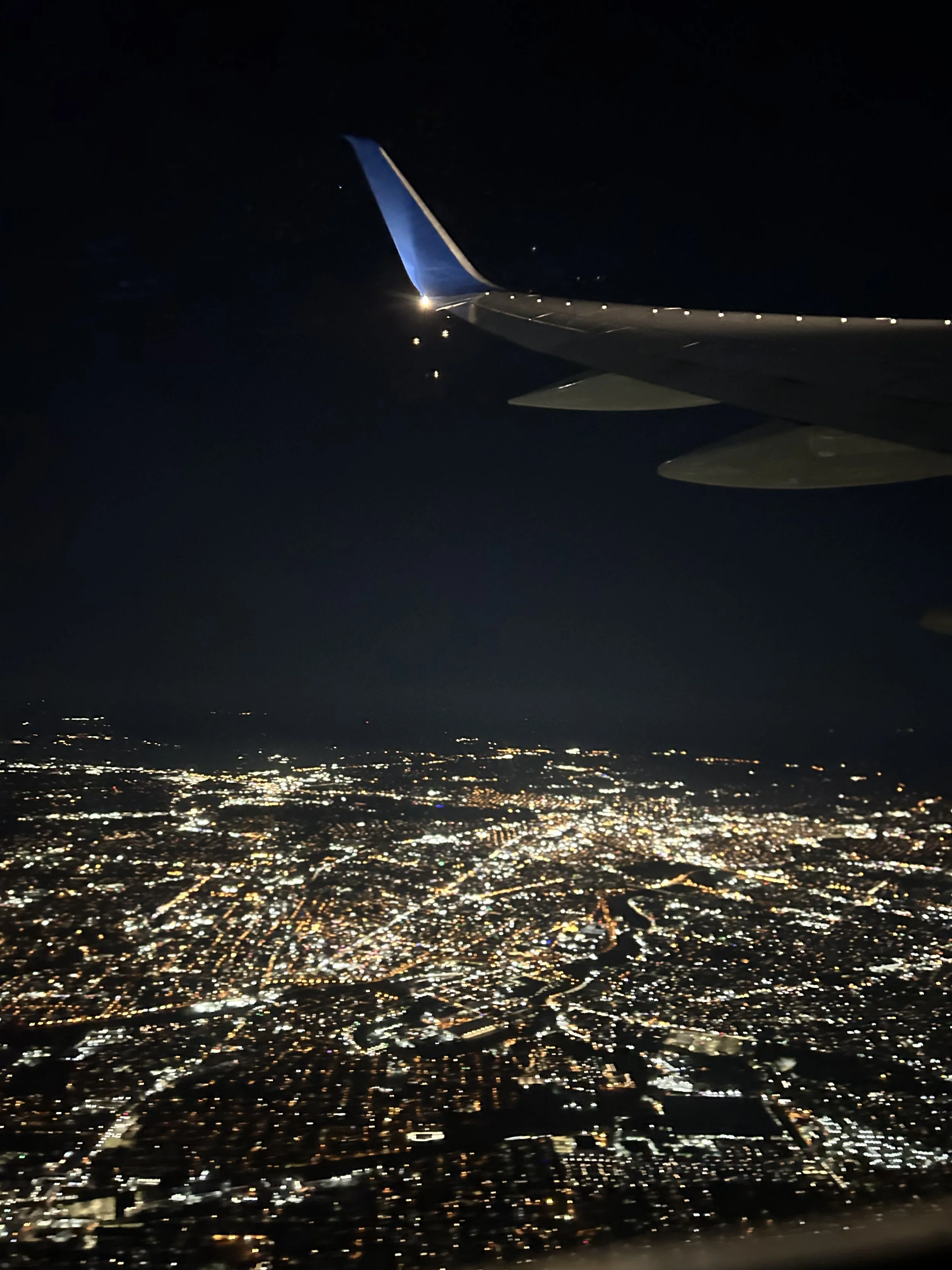 night time photo out of airplane window while flying