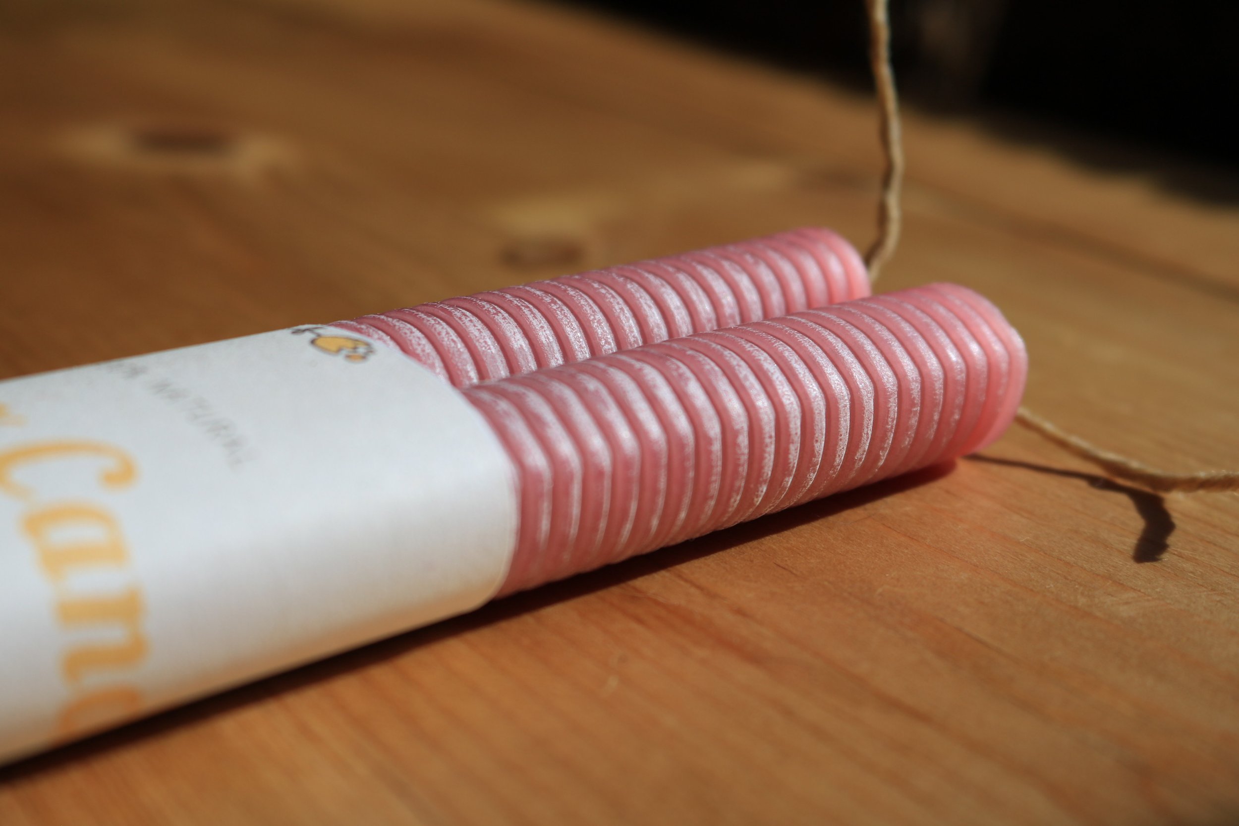Dusty Rose Pink hand-rolled corrugated beeswax candle