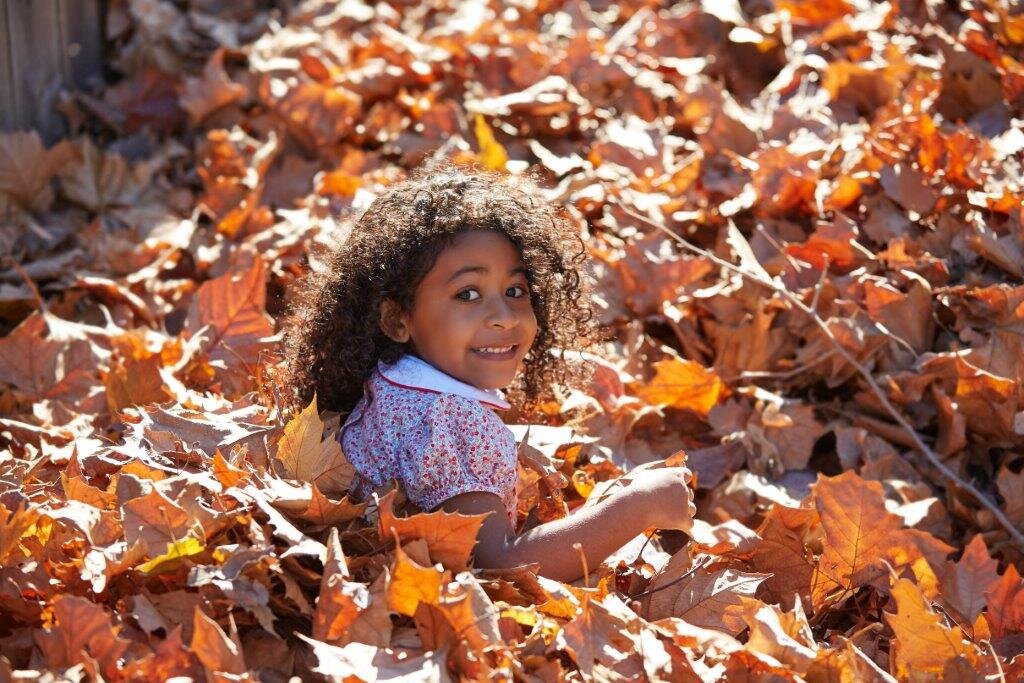 Kid in leaves.jpg