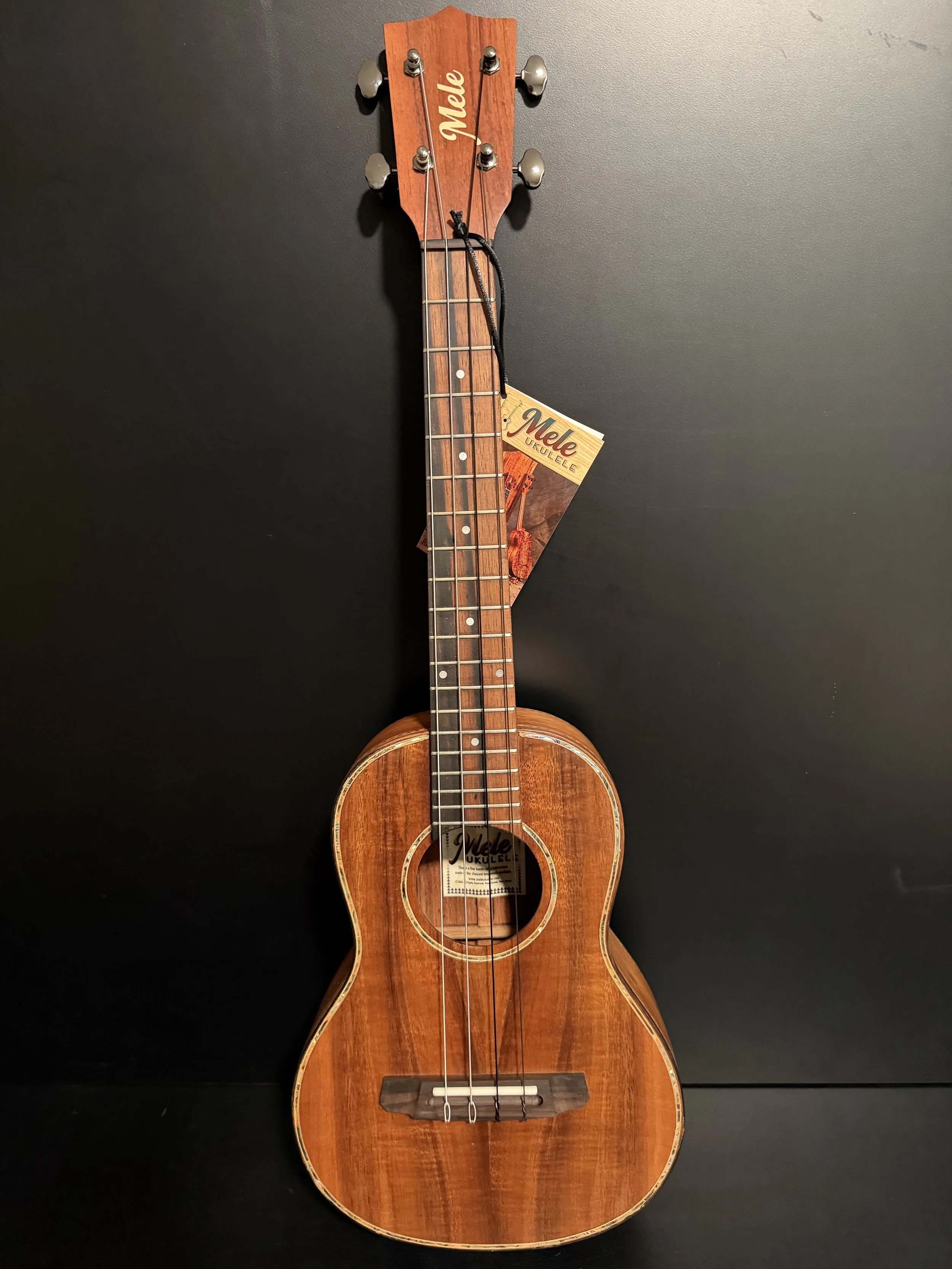 Mele Deluxe Curly Koa Tenor Ukulele with Abalone Shell Inlay