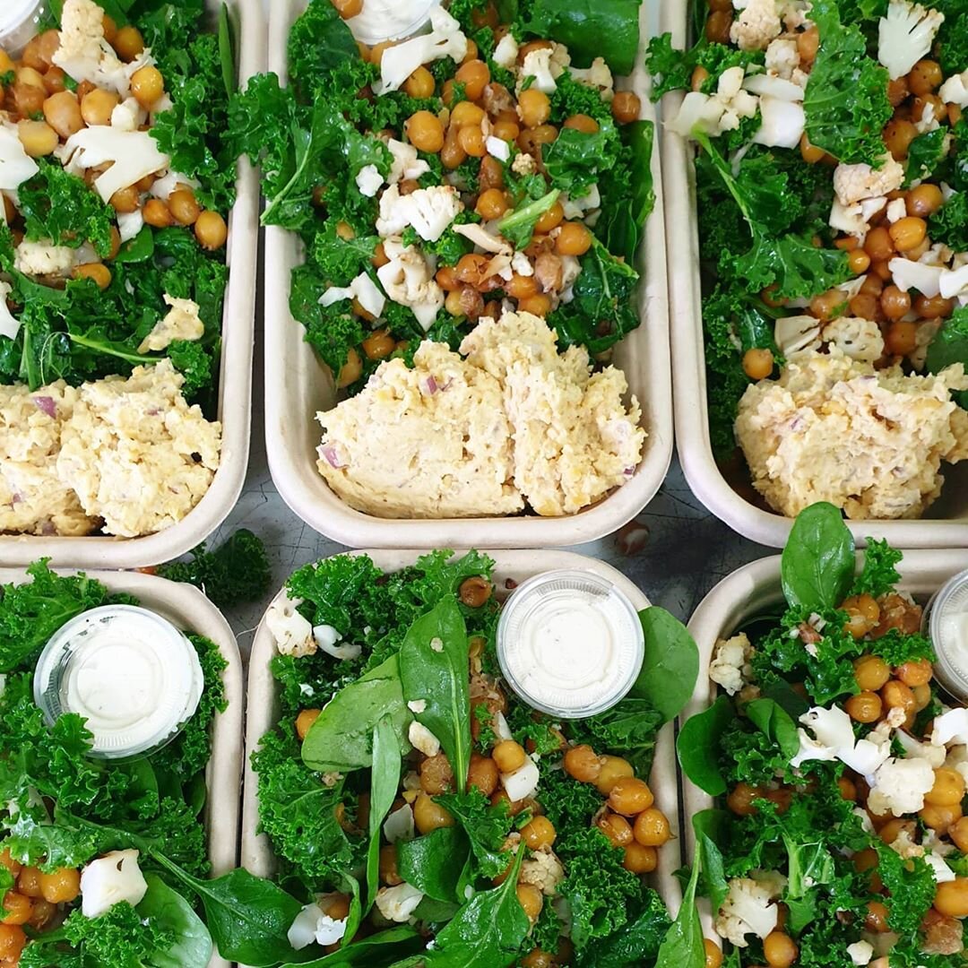 Kale caesar with crispy chickpeas and roasted cauliflower with chickpea tuna and vegan aioli at Pluto’s