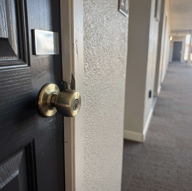 Landlord holding brass key ring with spare keys