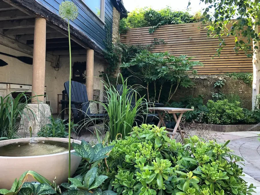 Beaminster garden by Anna Sissons Garden Design Garden design showing water feature and mixed planting