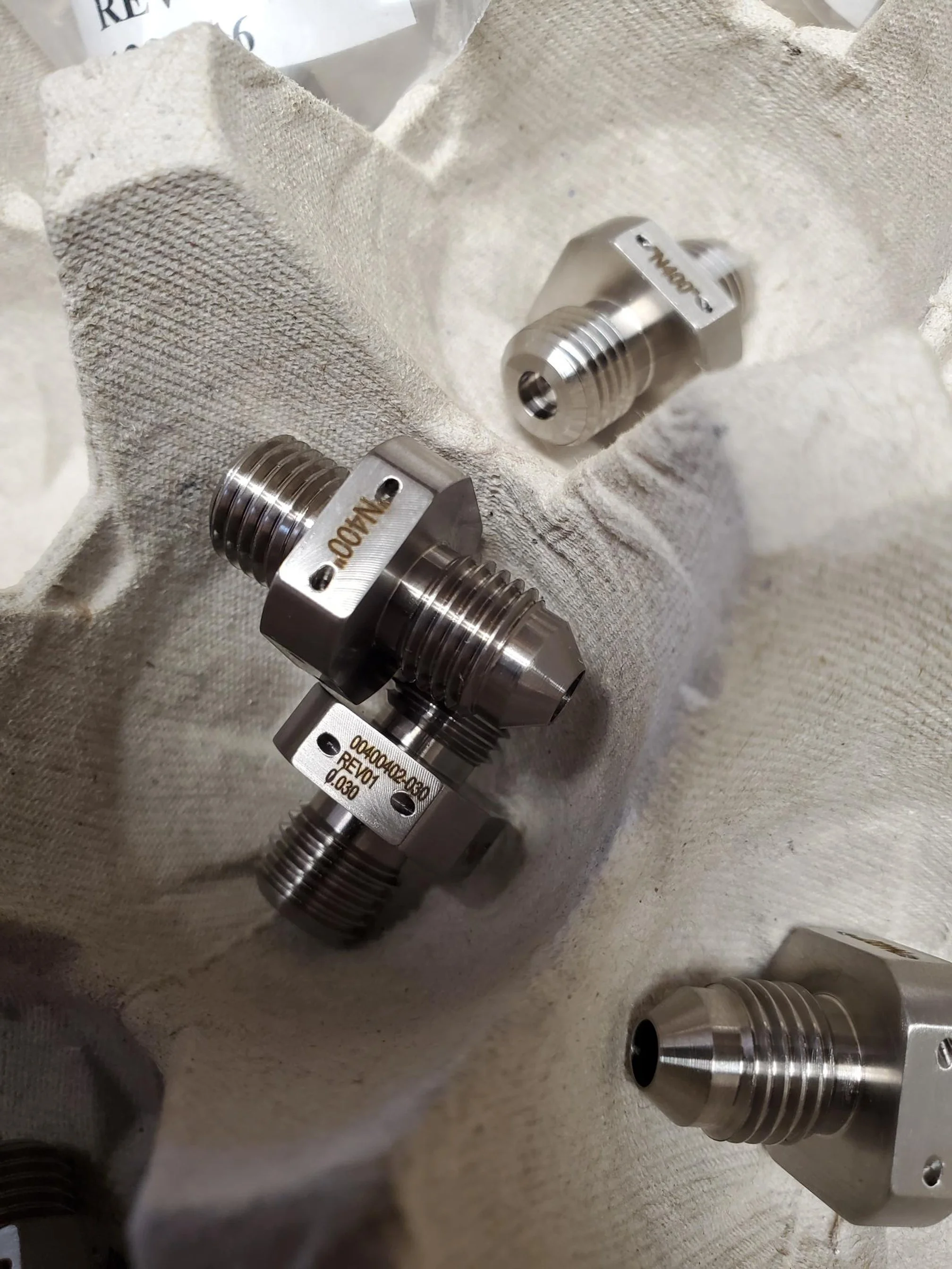 laser marked precision machined metal fittings with engraved part identification