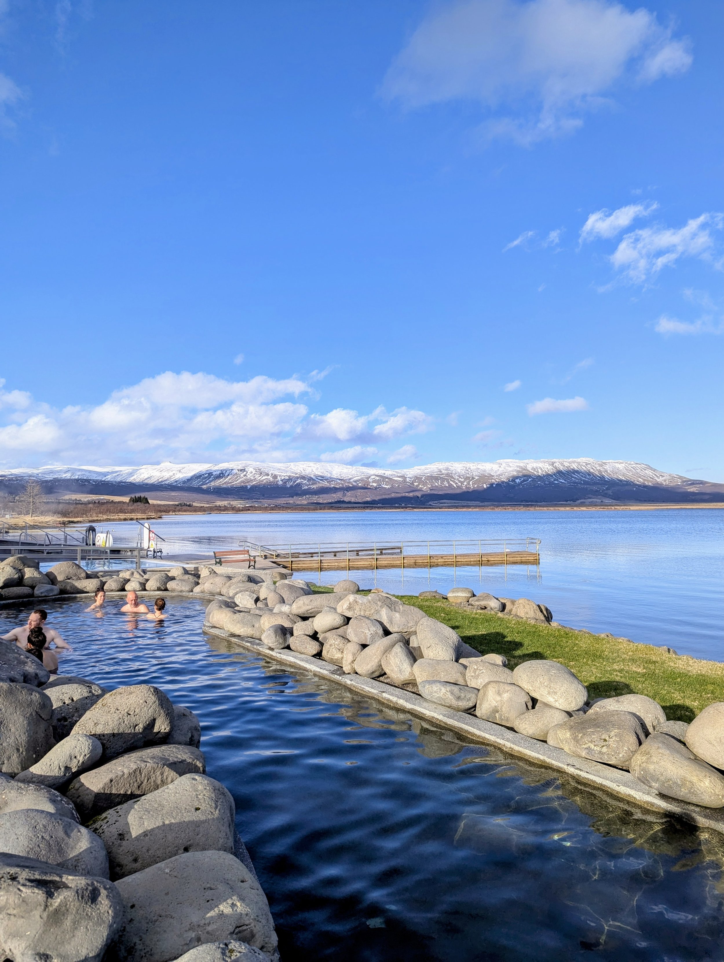 Geothermal pool with mountain backdrop.jpg