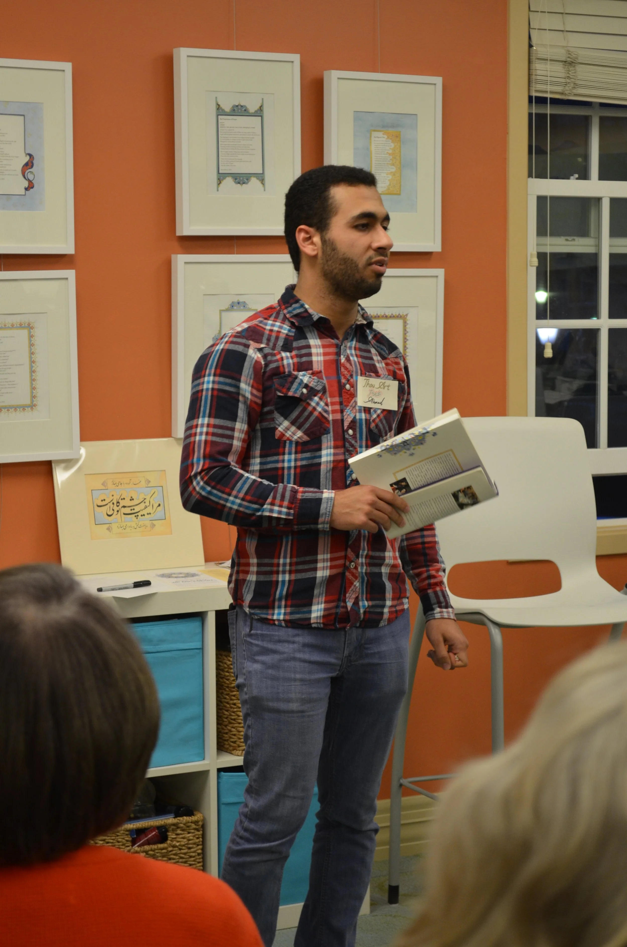 Ahmad reads his poem at the book launch