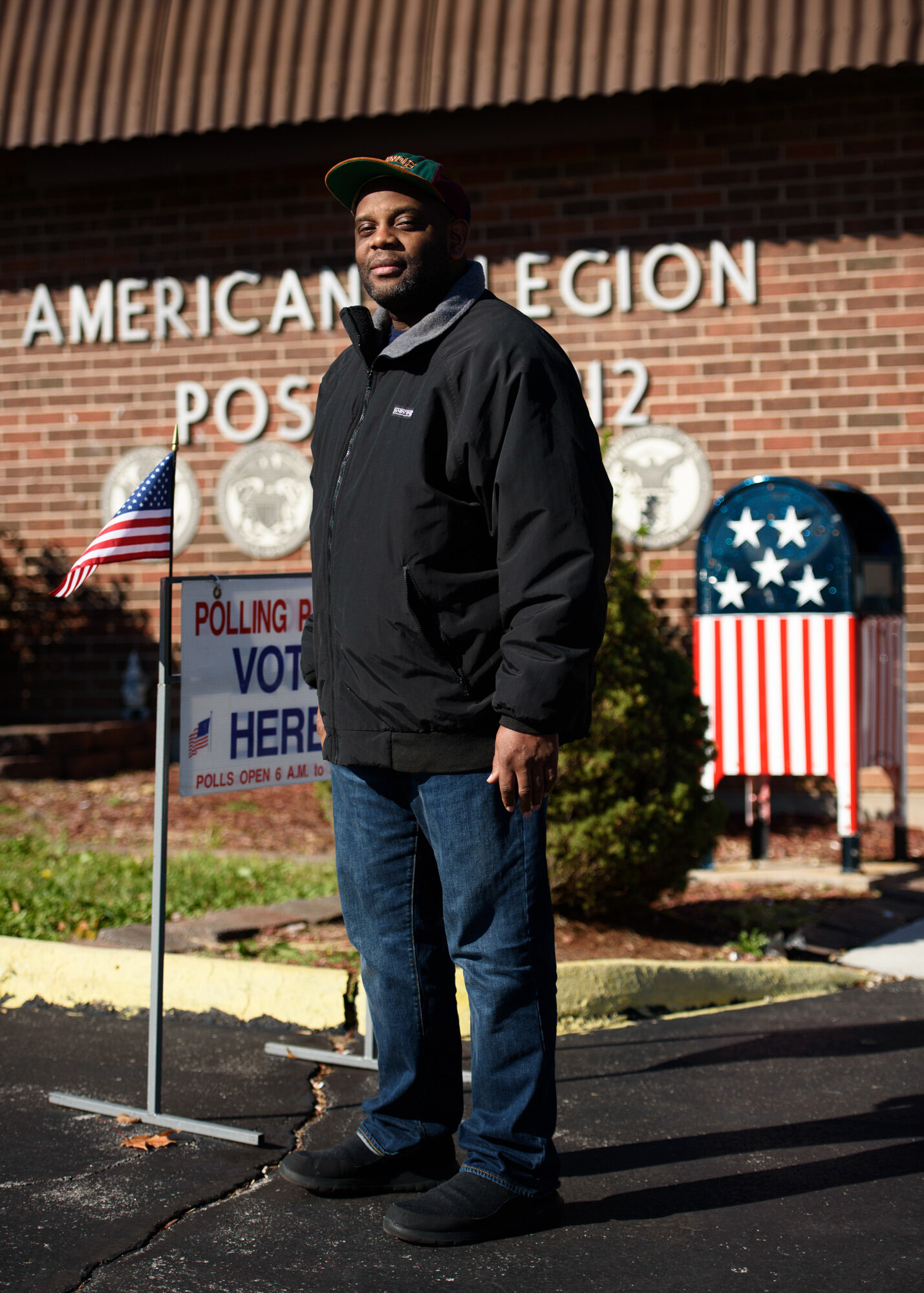 Eugene Horn, 47, a General Motors factory worker, stands for a portrait outside his polling station at the American Legion Post 312 in St. Charles, Mo. on Tuesday, November 6, 2018.