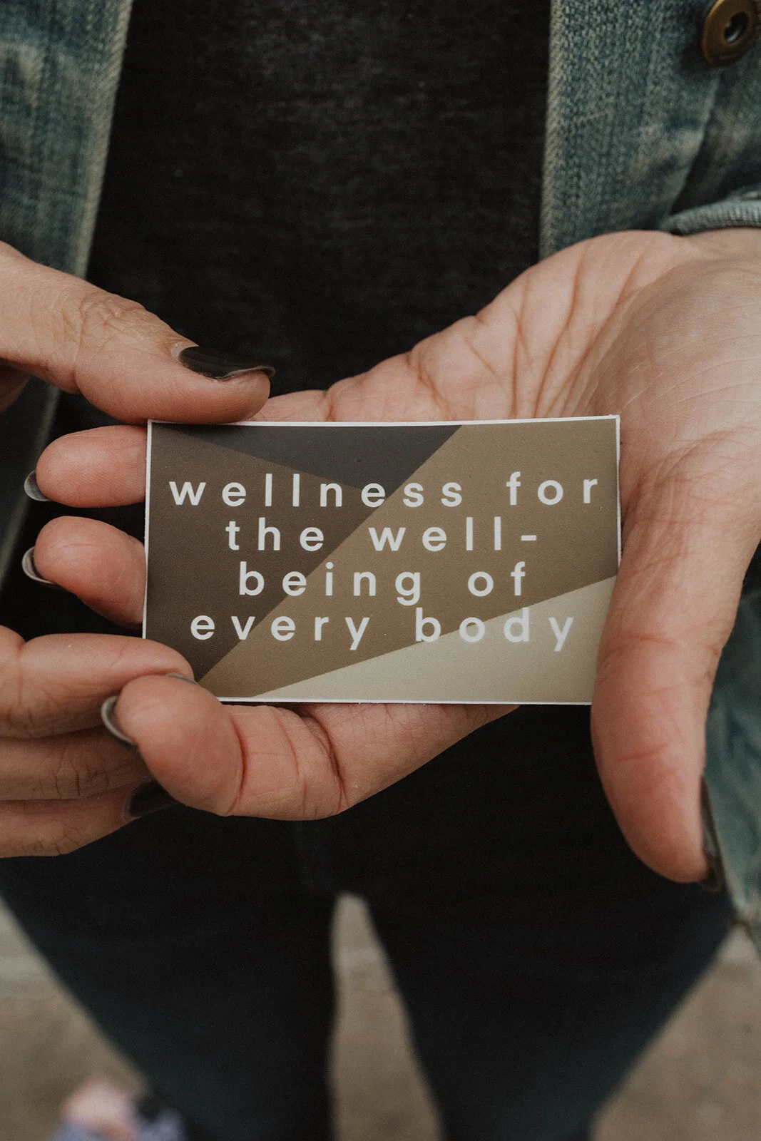 Wellness For The Well-Being of Every Body sticker in hand by Maven Made