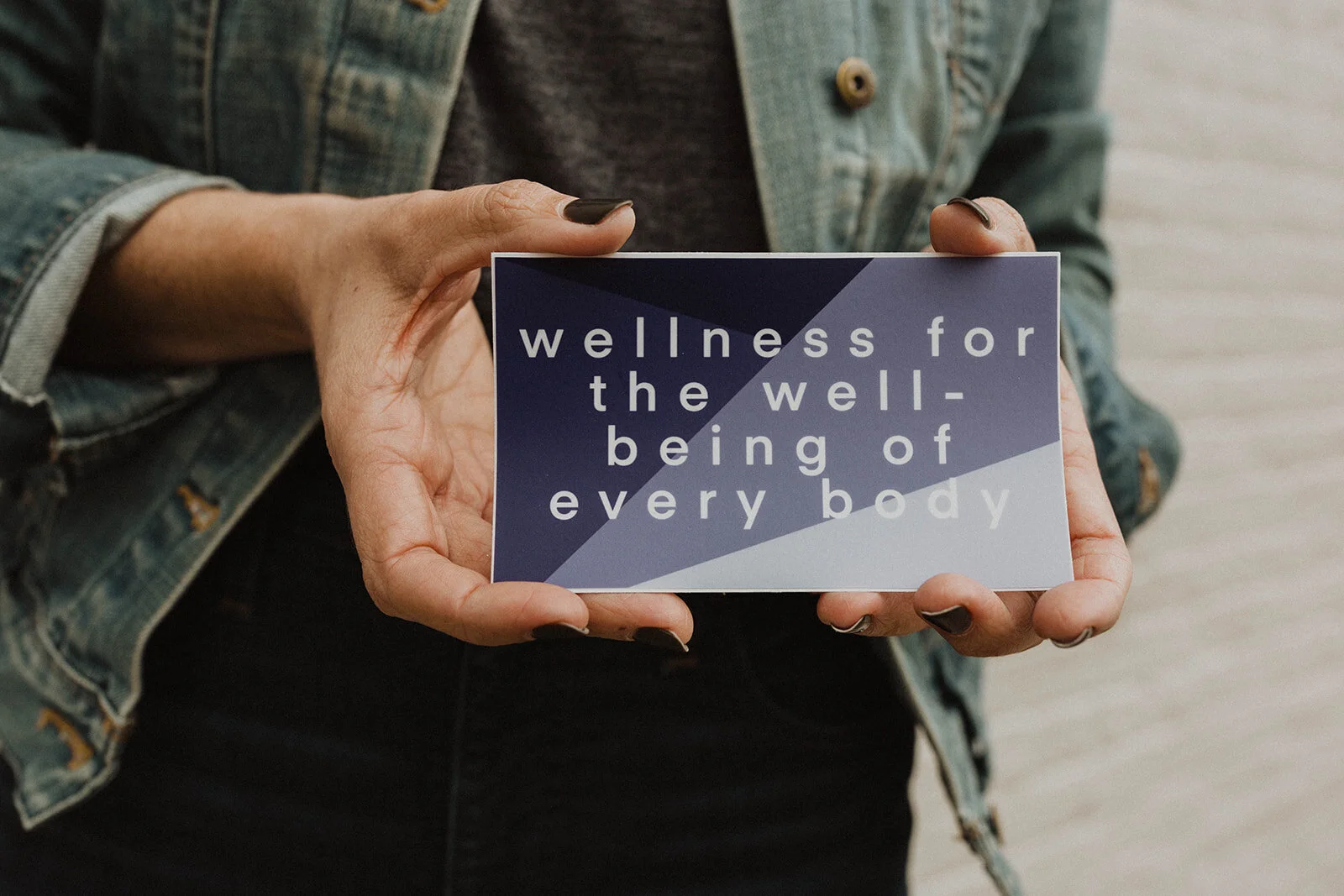 Wellness For The Well-Being of Every Body sticker in hand by Maven Made