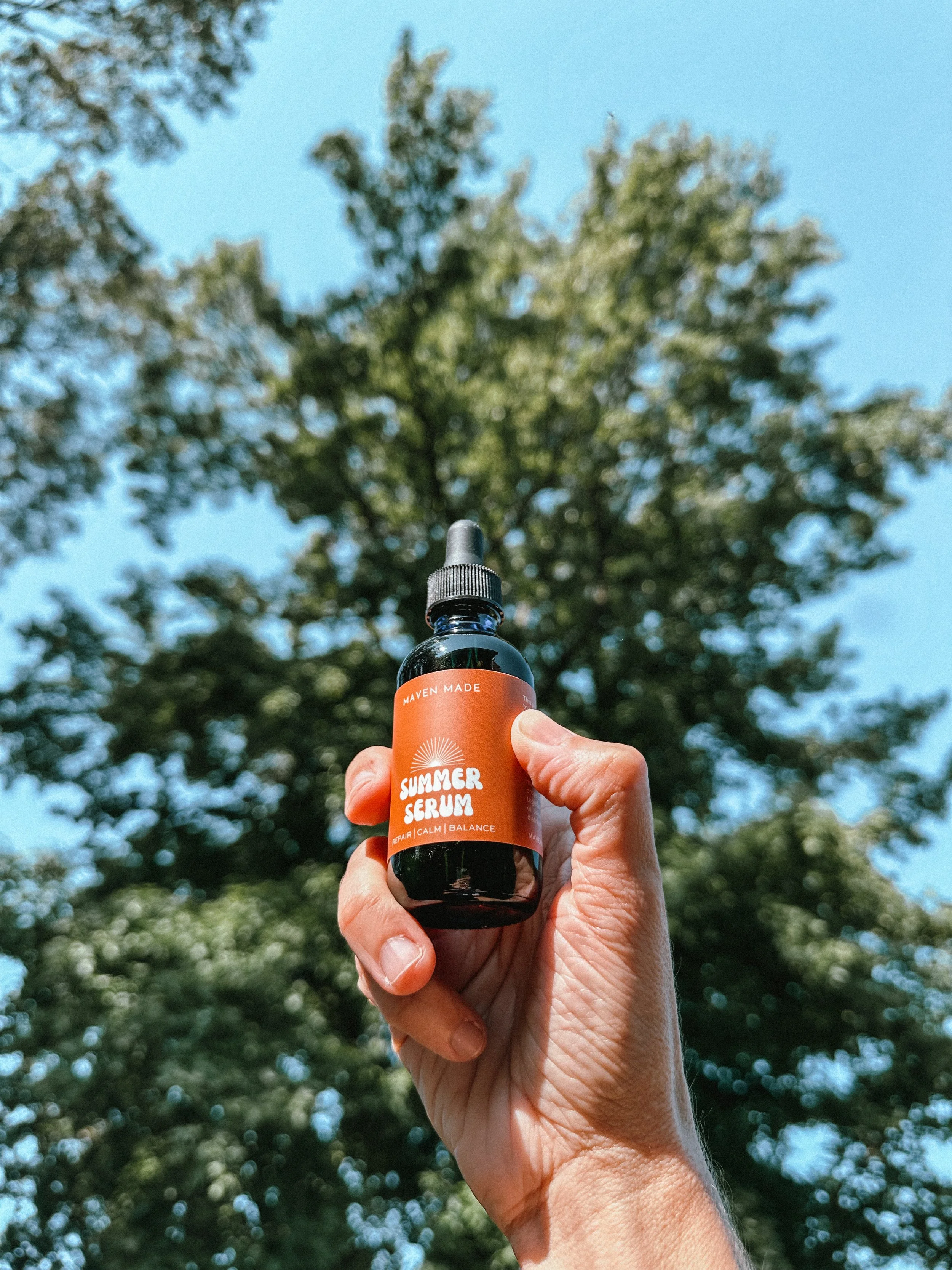 Summer Serum face oil in hand.JPG