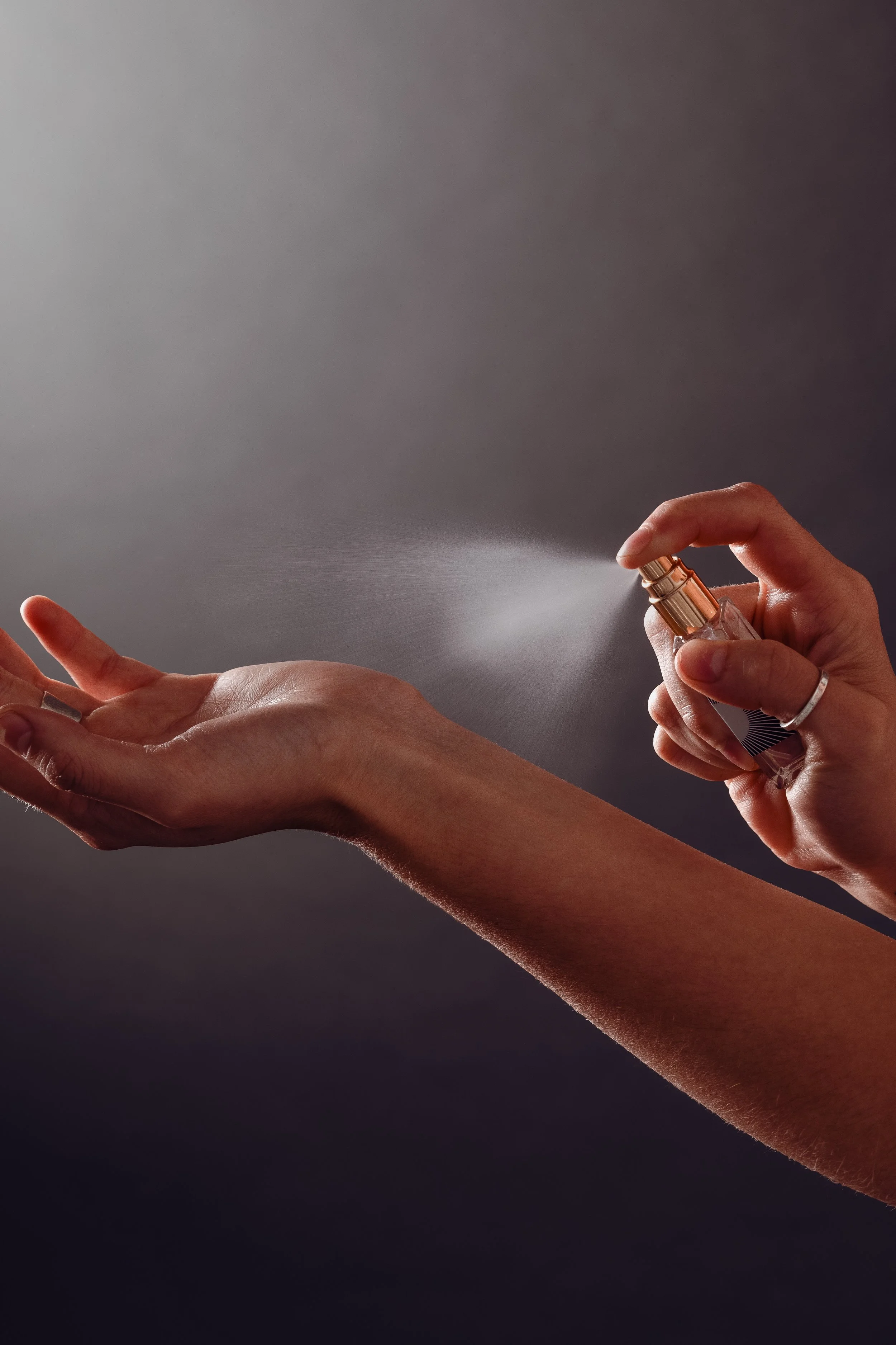 mini Maven Made perfume vial spraying on wrist