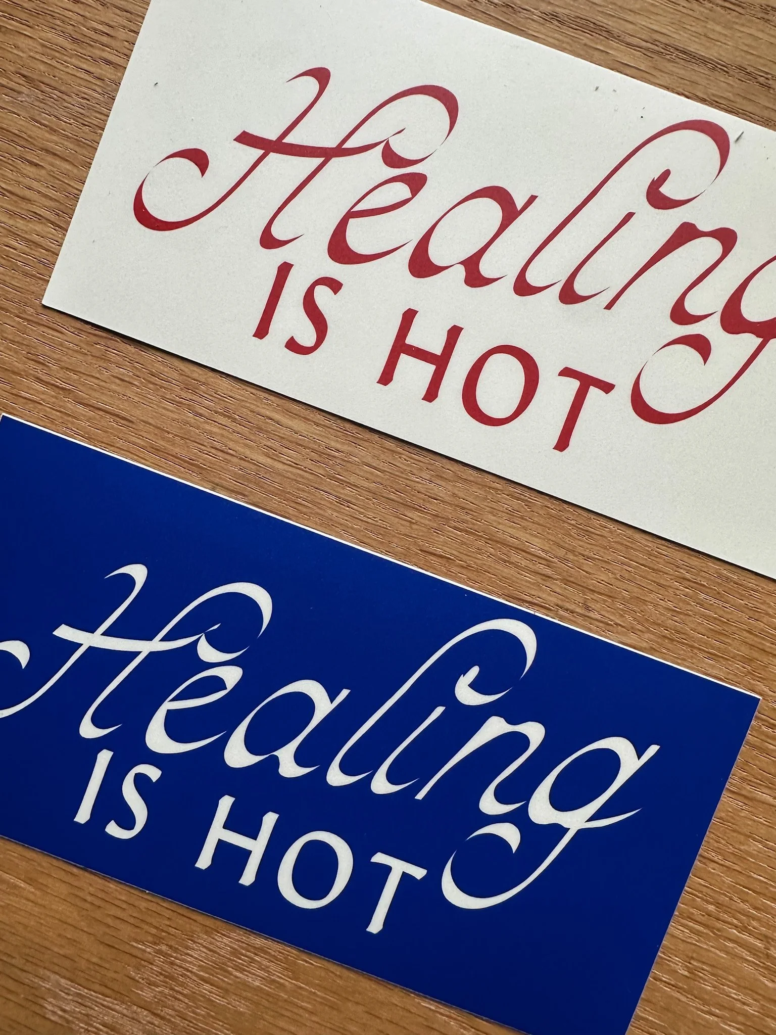 Healing is Hot bumper stickers wooden background.jpg