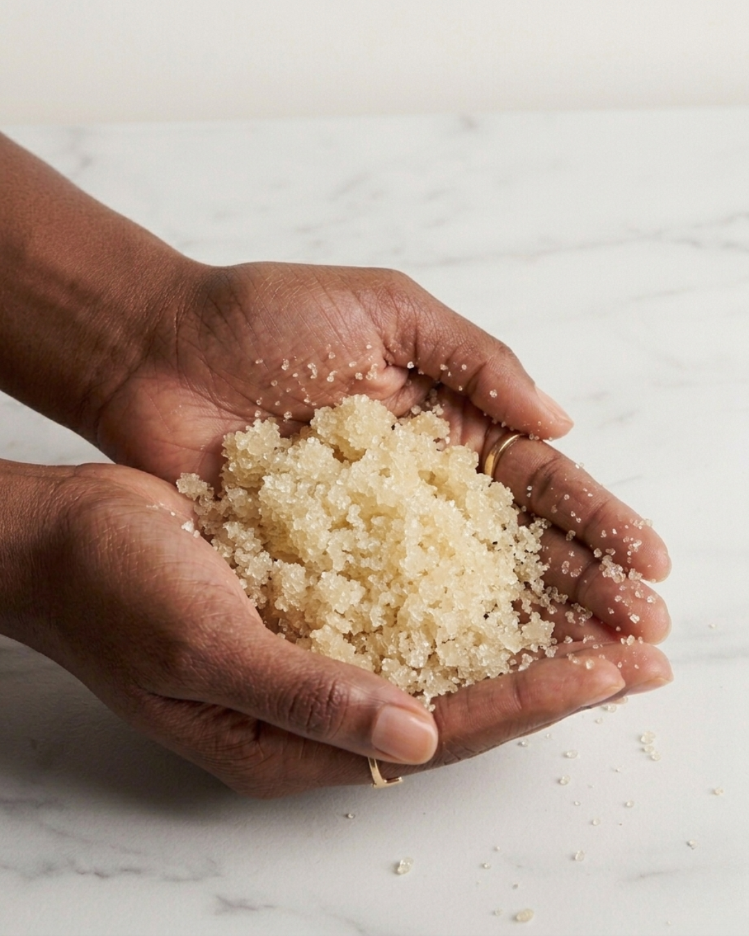 Maven Made Every Body Scrub placed in hands