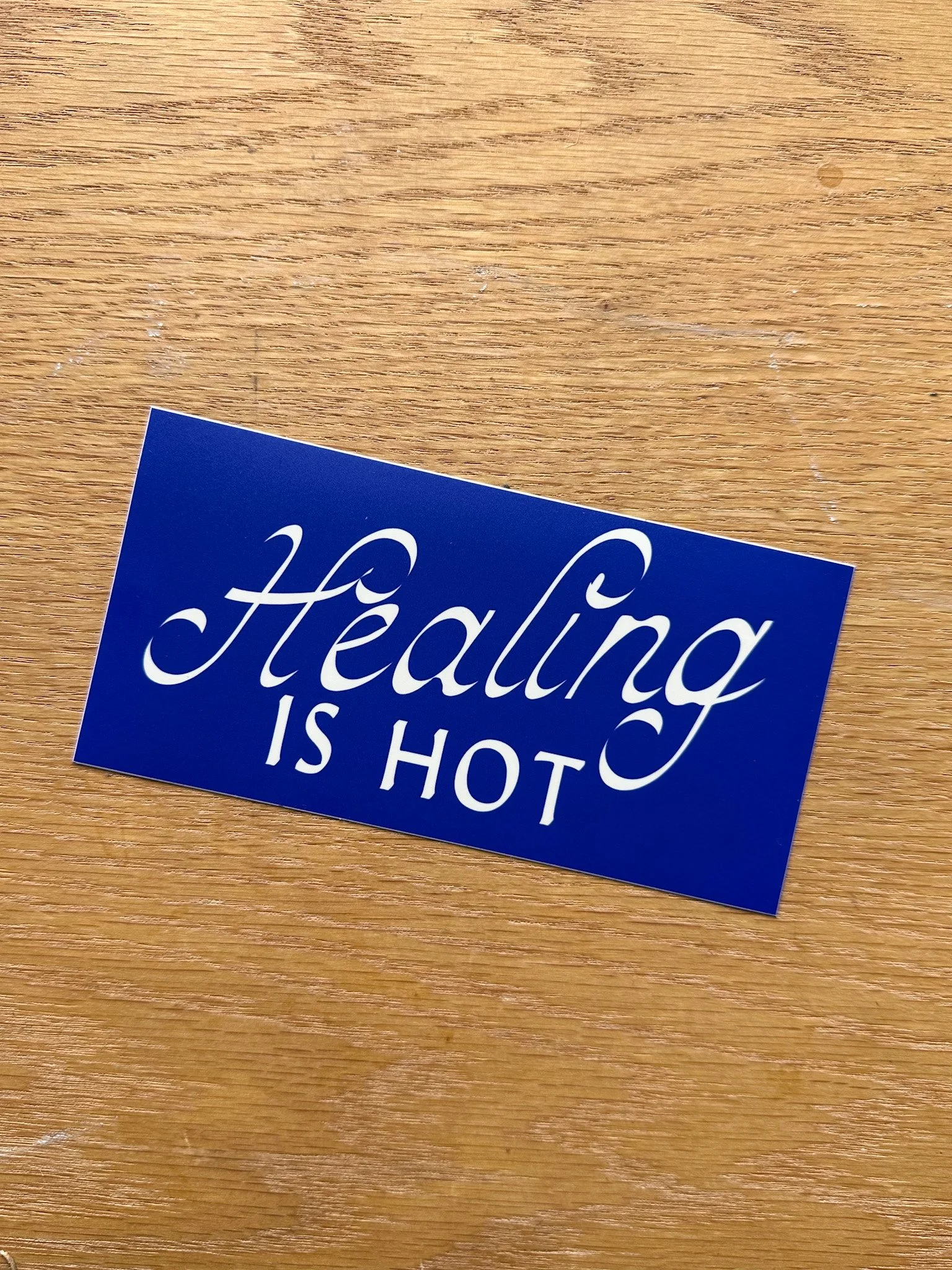 cobalt blue and white Healing is Hot bumper sticker.jpg