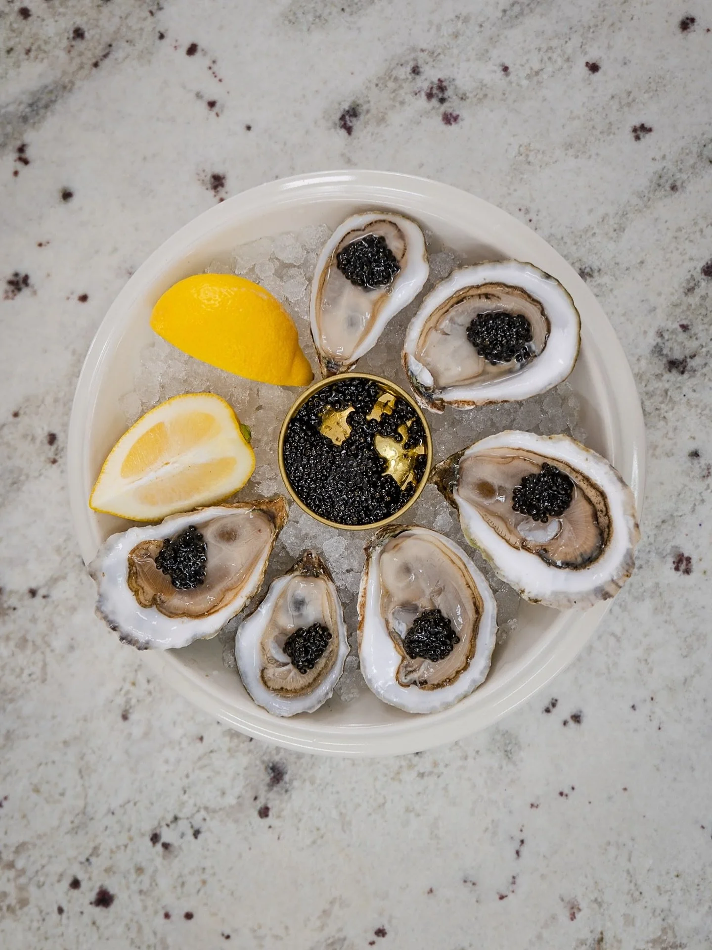 From tide to table &mdash; oysters crowned in caviar, served on ice, kissed with lemon. 🌊🍋 Luxury never tasted this fresh. 🦪🖤