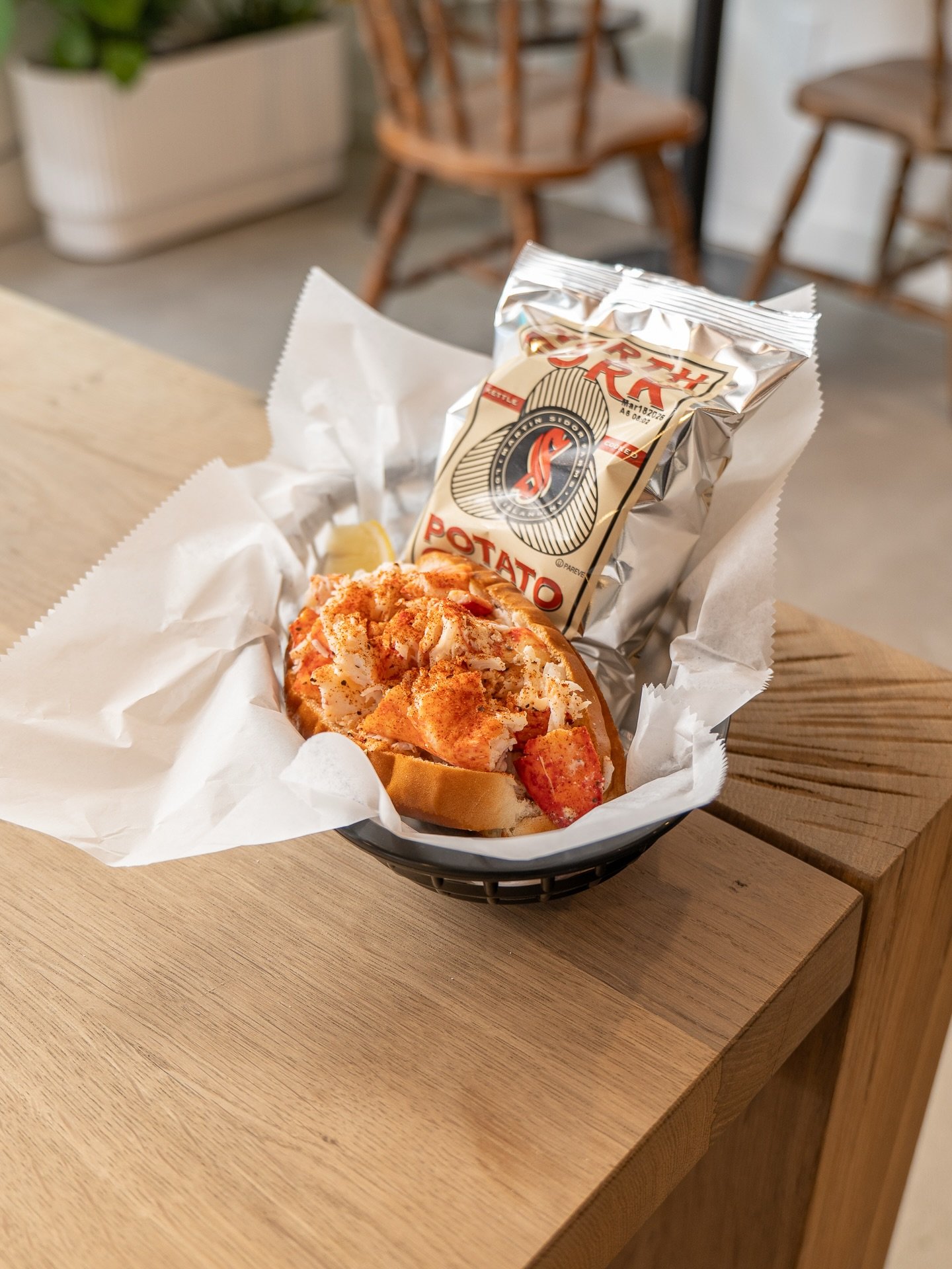 Our famous Maine-style lobster roll, bringing a taste of summer to the coziest days of winter. ❄️🦞✨