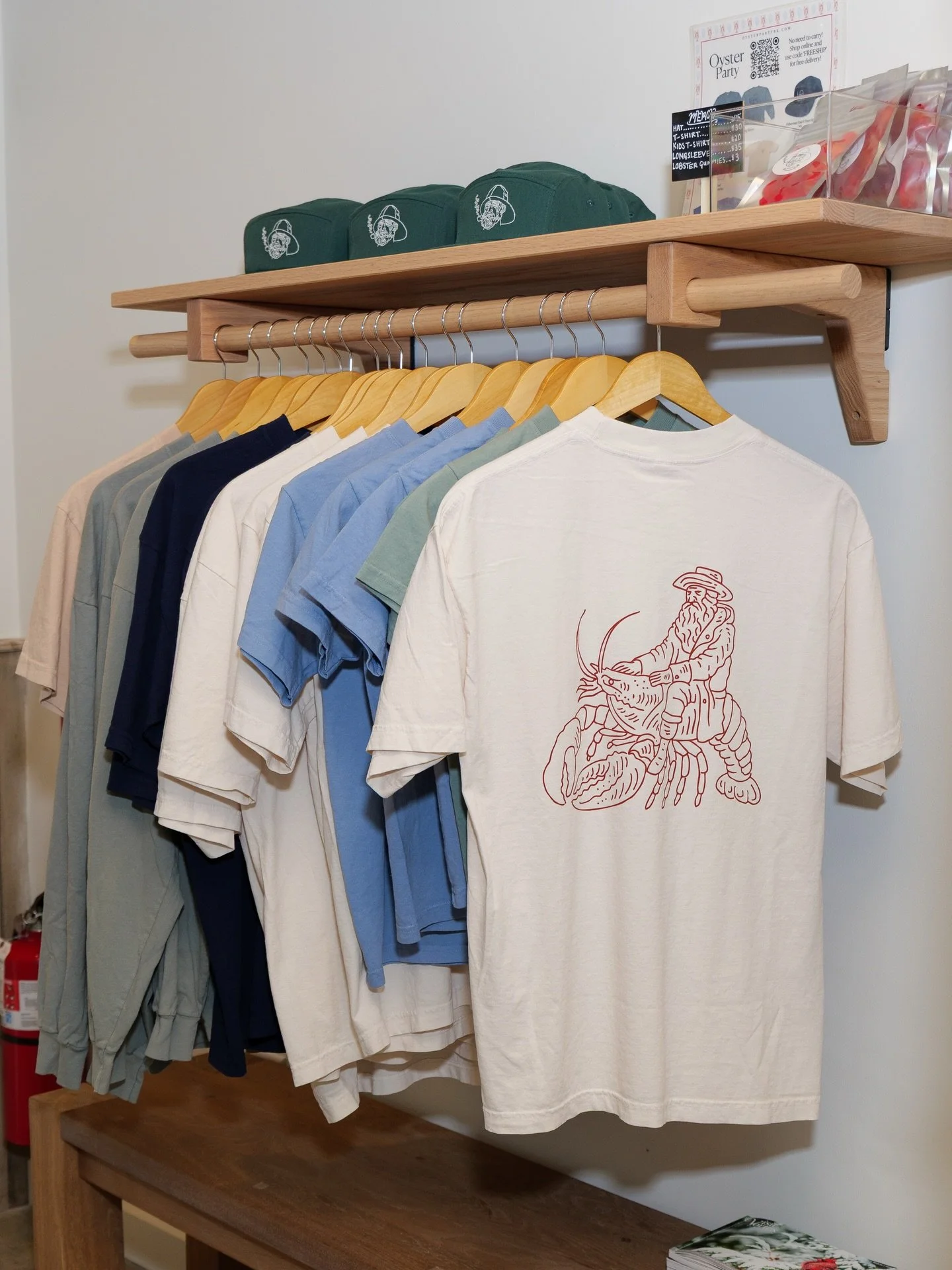 The Woodstock merch rack is filled with the perfect gear for your spring wardrobe! 👕 Available at our online shop and in-store. ✨
