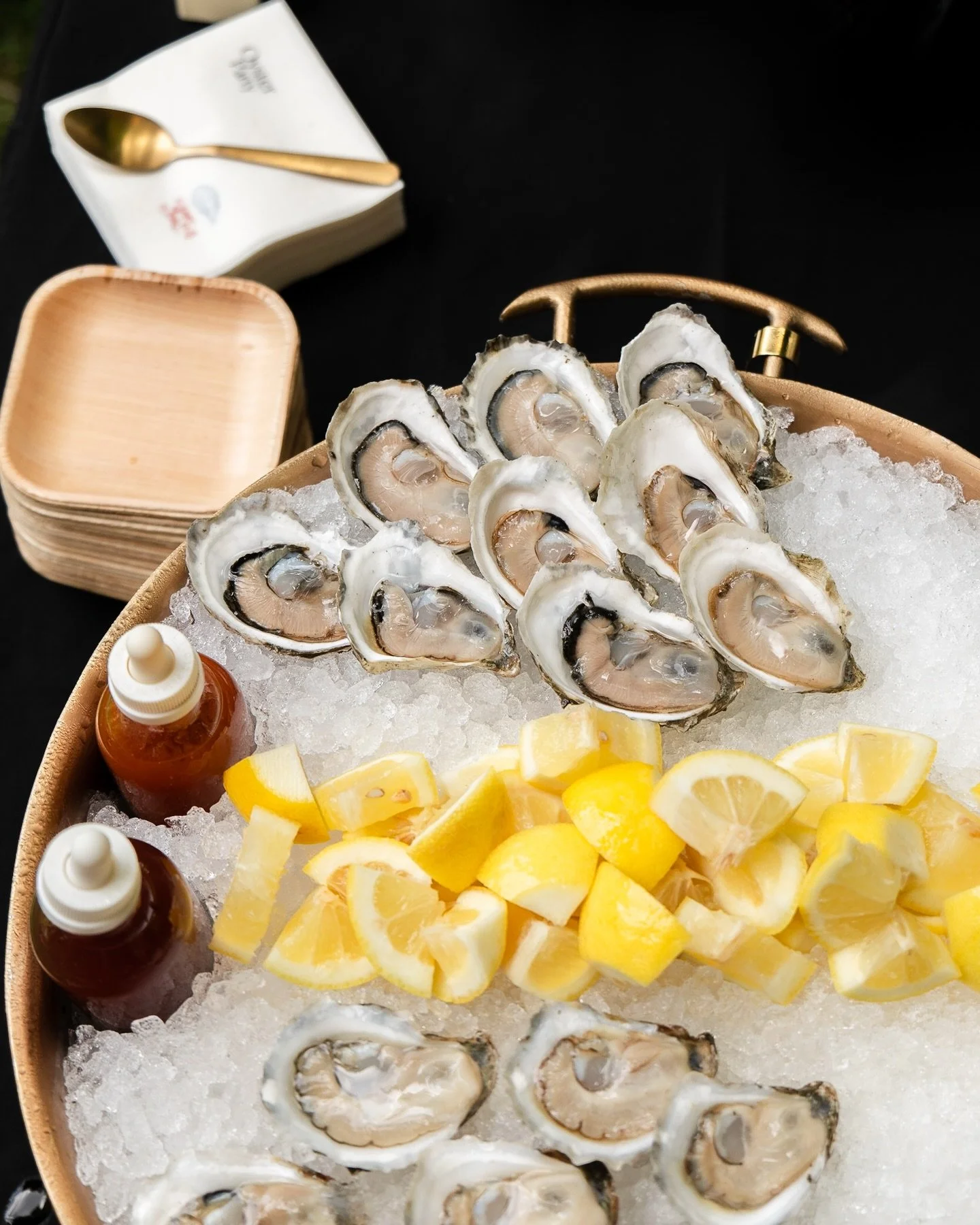 🦪 Enjoying fresh shucked oysters and sipping chilled wine on a summer night. 🍷 Let us curate raw bar for your summer party. ☀️ More details in our link in bio. ✨