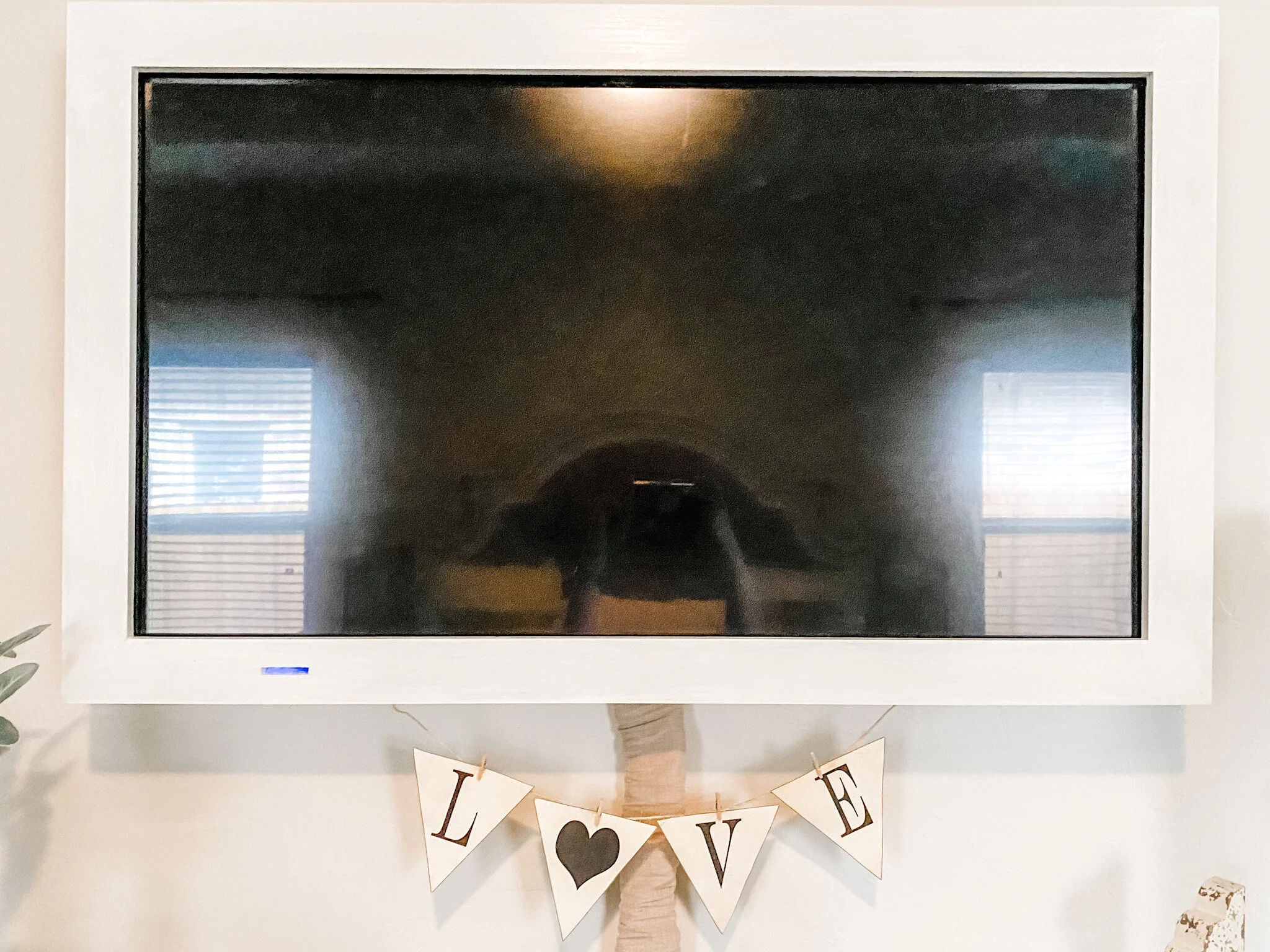 I love to watch TV. I do not love TVs in room design. Solution? Beautiful handmade TV frame to hide all the ugliness and create a clean and pretty look.
