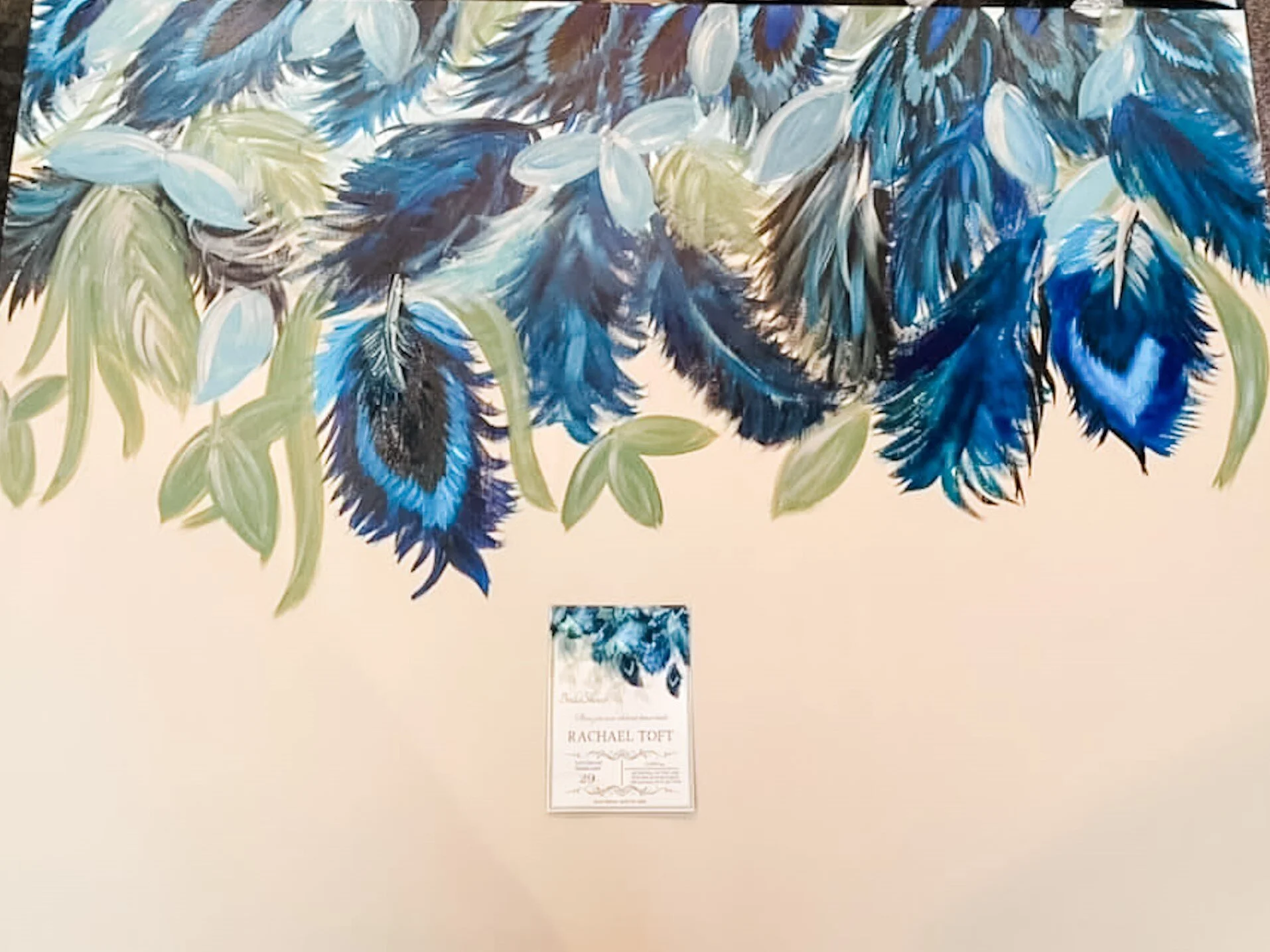 I painted a large canvas to match the shower invitation. The canvas hung above the mantel as decoration.
