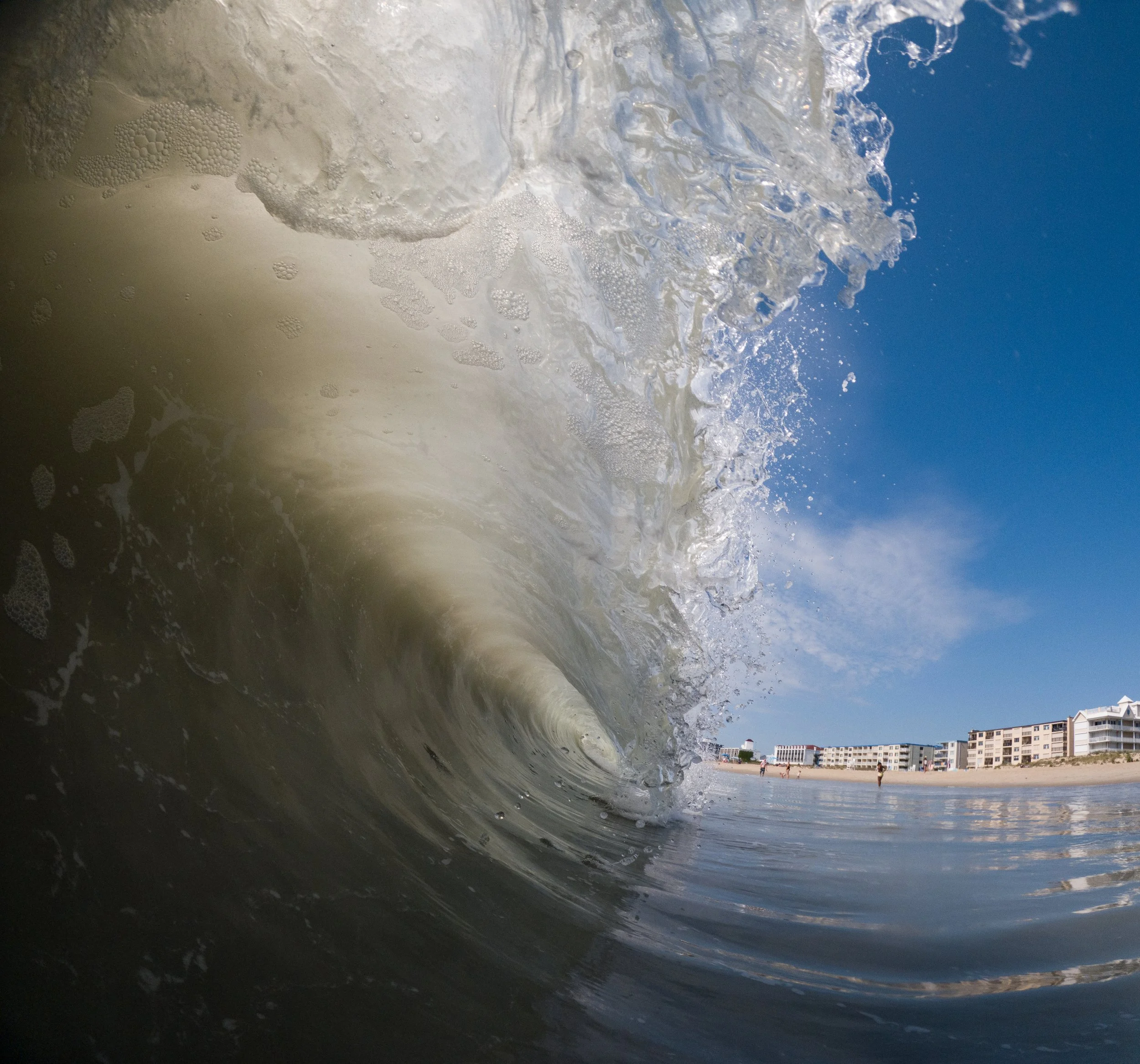 Ocean City Beach Category: "Down the Line" by Jason Dawson . Photo Description: The beach to me has never been about sitting on the sand. It has always been about being in the ocean. So many of my favorite childhood memories are in the sea with my da