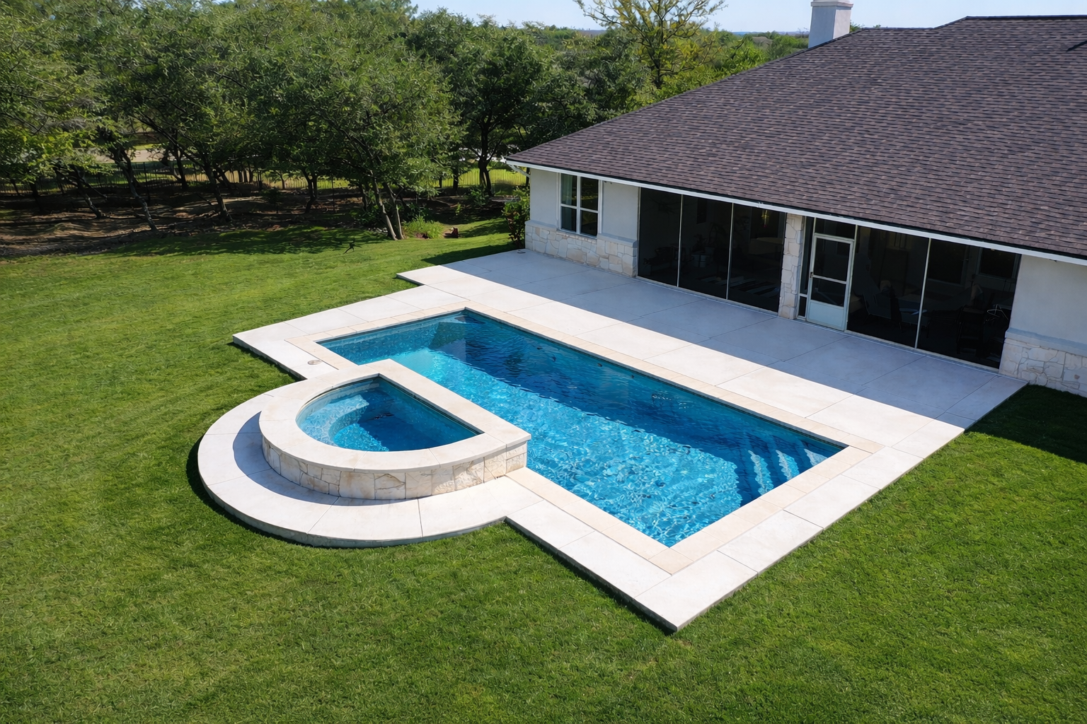 A backyard with a new rectangular swimming pool and attached hot tub, surrounded by a concrete deck, with a house and grassy yard with trees and plants in the background. A badge with five gold stars and the text '5 Star Rated Pool' is displayed in the top right corner.