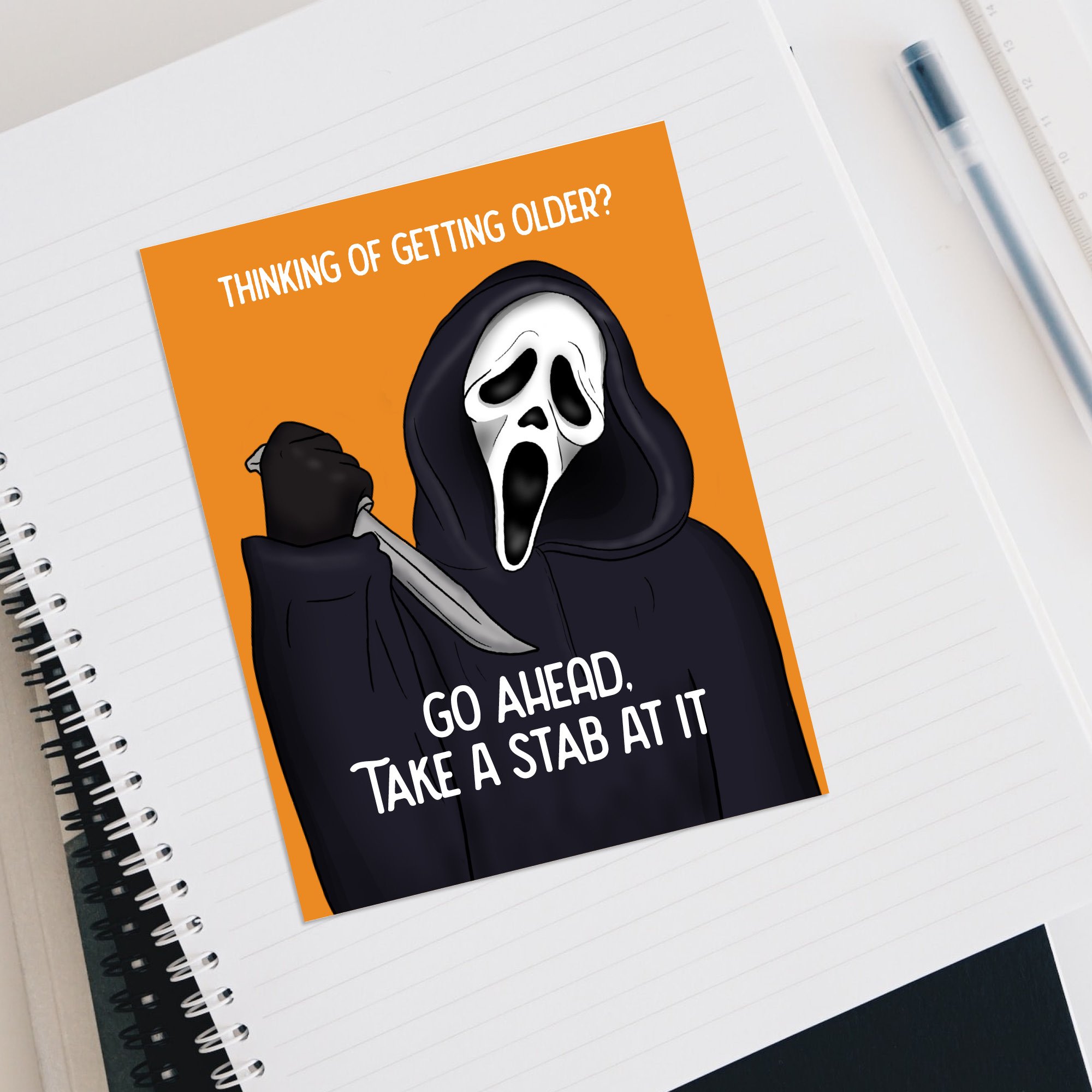 notebook ghostface flat lay.jpg
