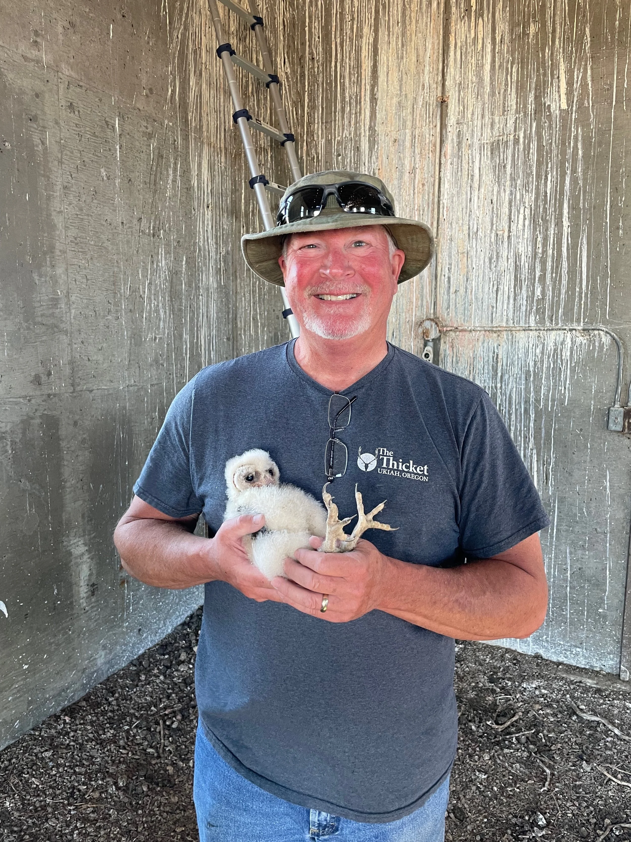 My dad, happy as can be, with a Barn Owl nestling.