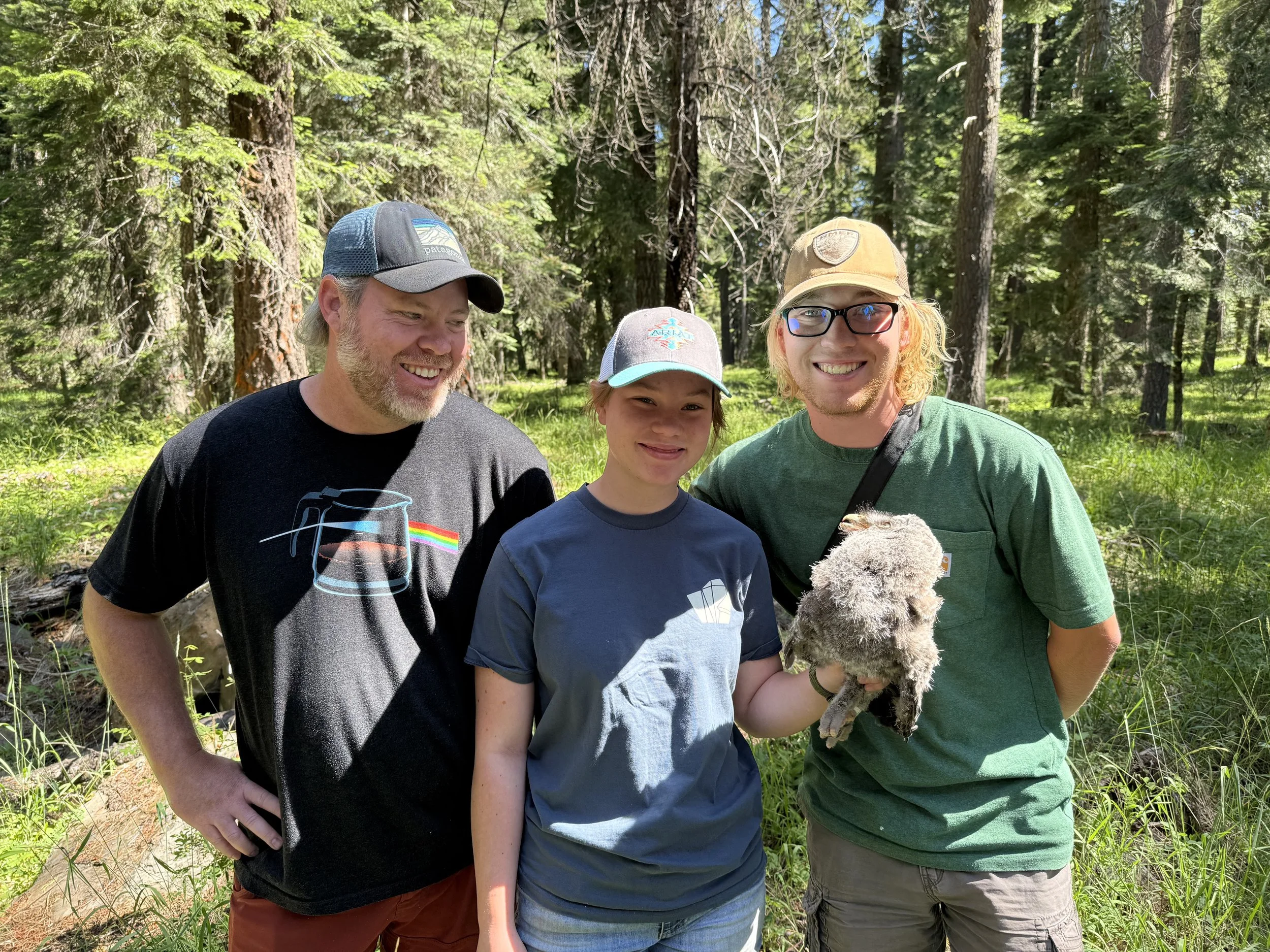Elliott, with his dad and sister, posing with the last banded juvenile of the season.