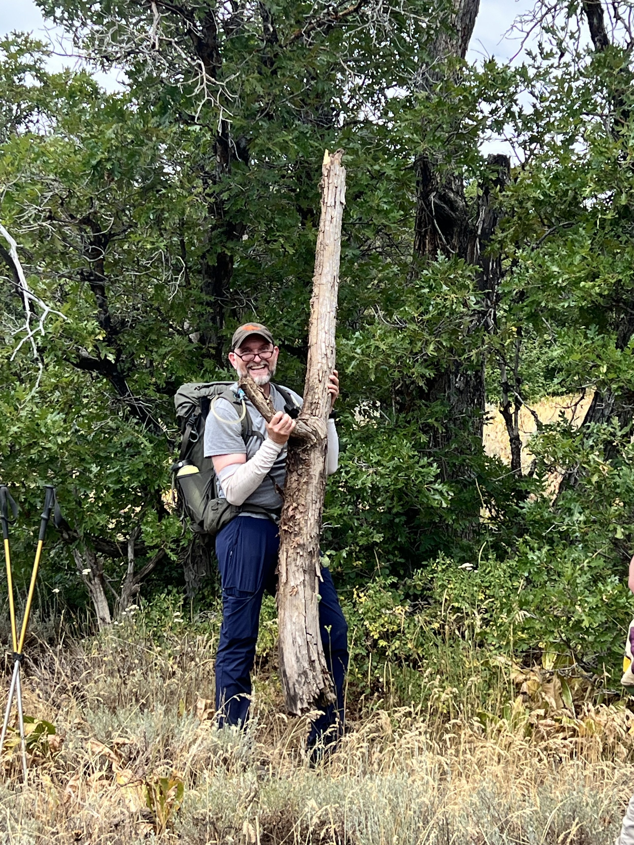 Markus with a branch of a tree that he has a history with. 