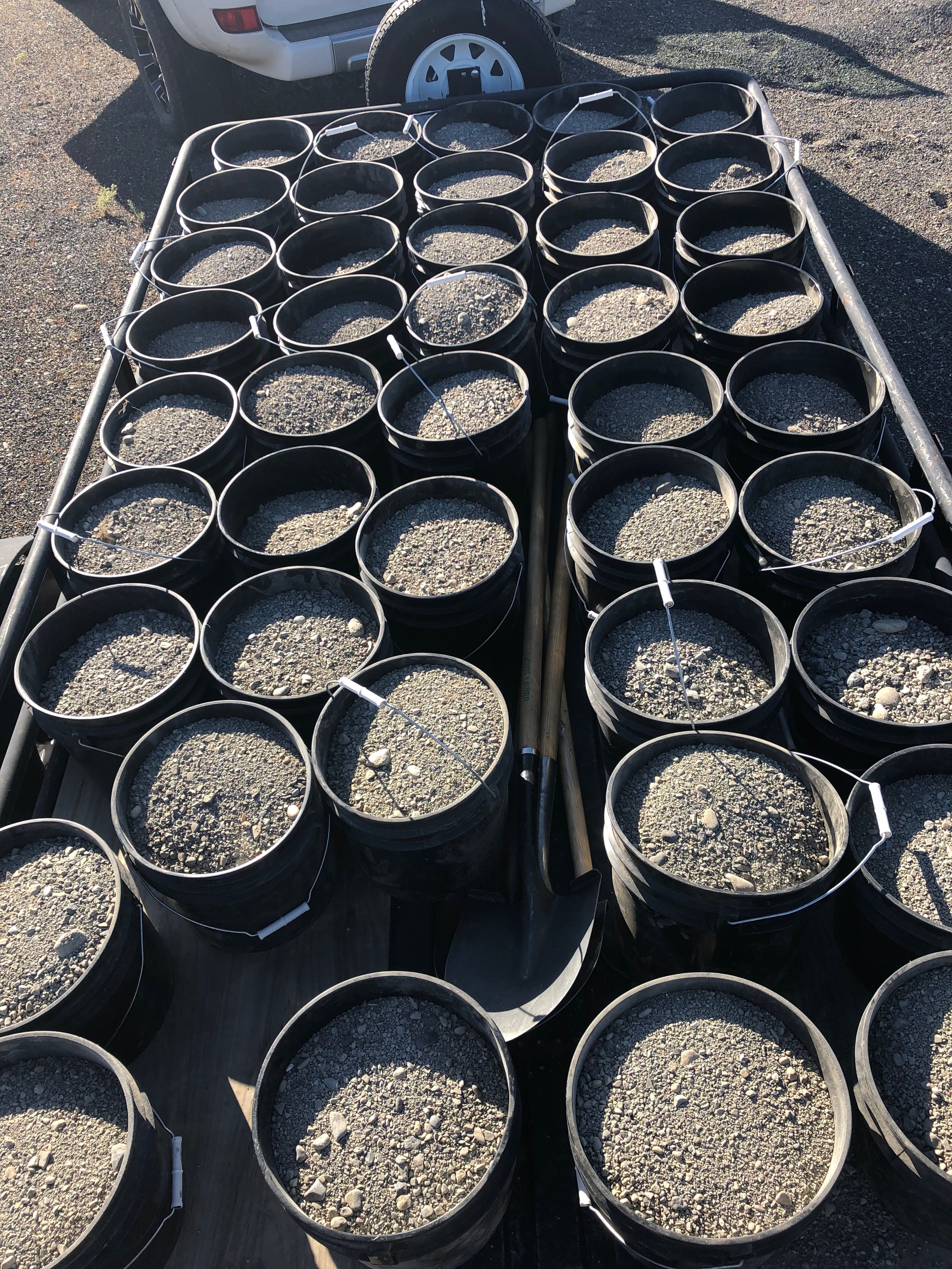 My 4Runner and trailer loaded up with buckets full of pea gravel.