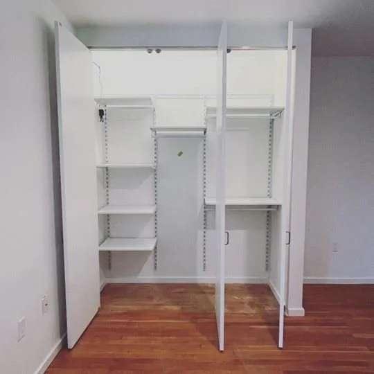 Magiglide Custom Bifold Door System installed to maximize space and storage in residential condo homes in urban development.