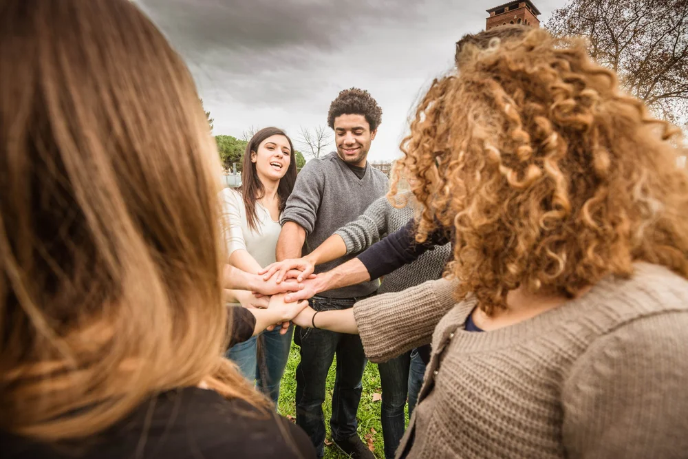 Community joining hands.jpg