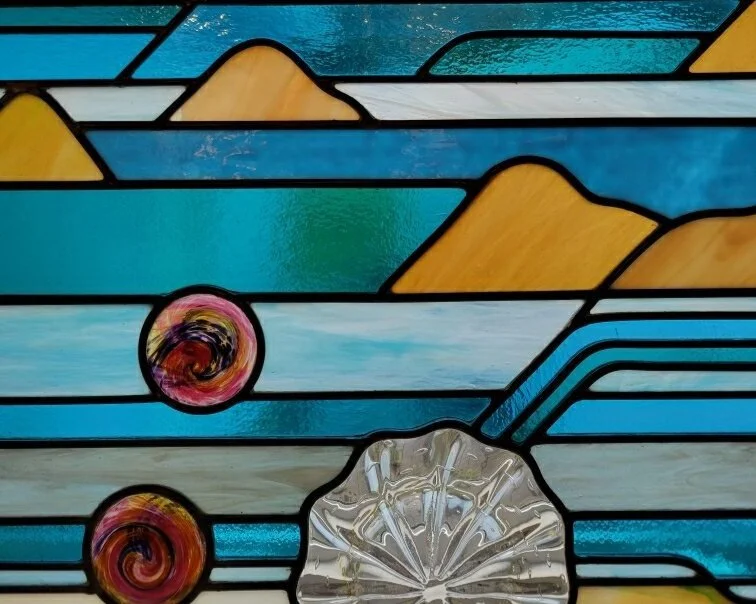 In a glass of his own