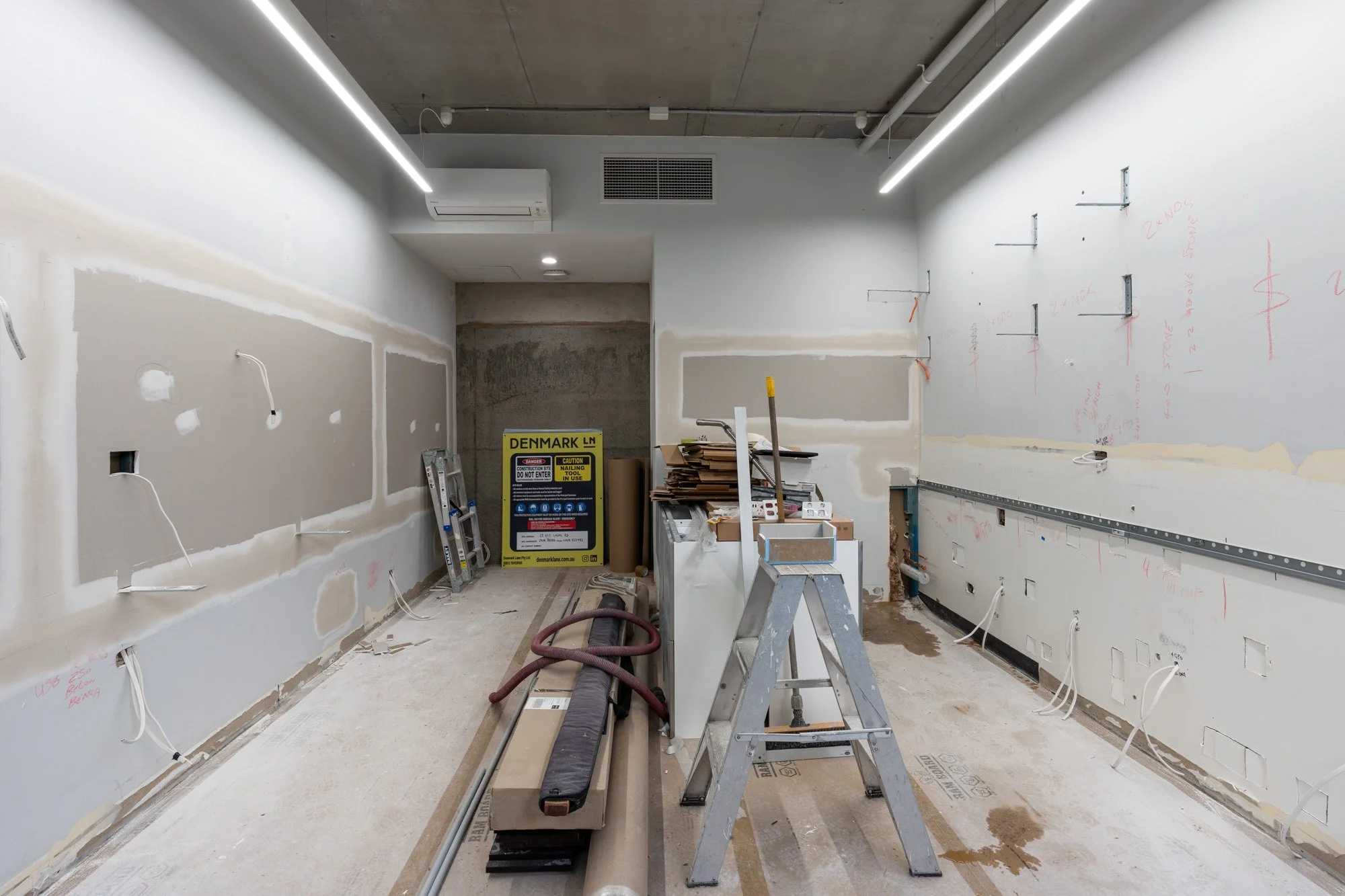 Dieter Slicke's barbershop fitout under construction by Denmark Lane