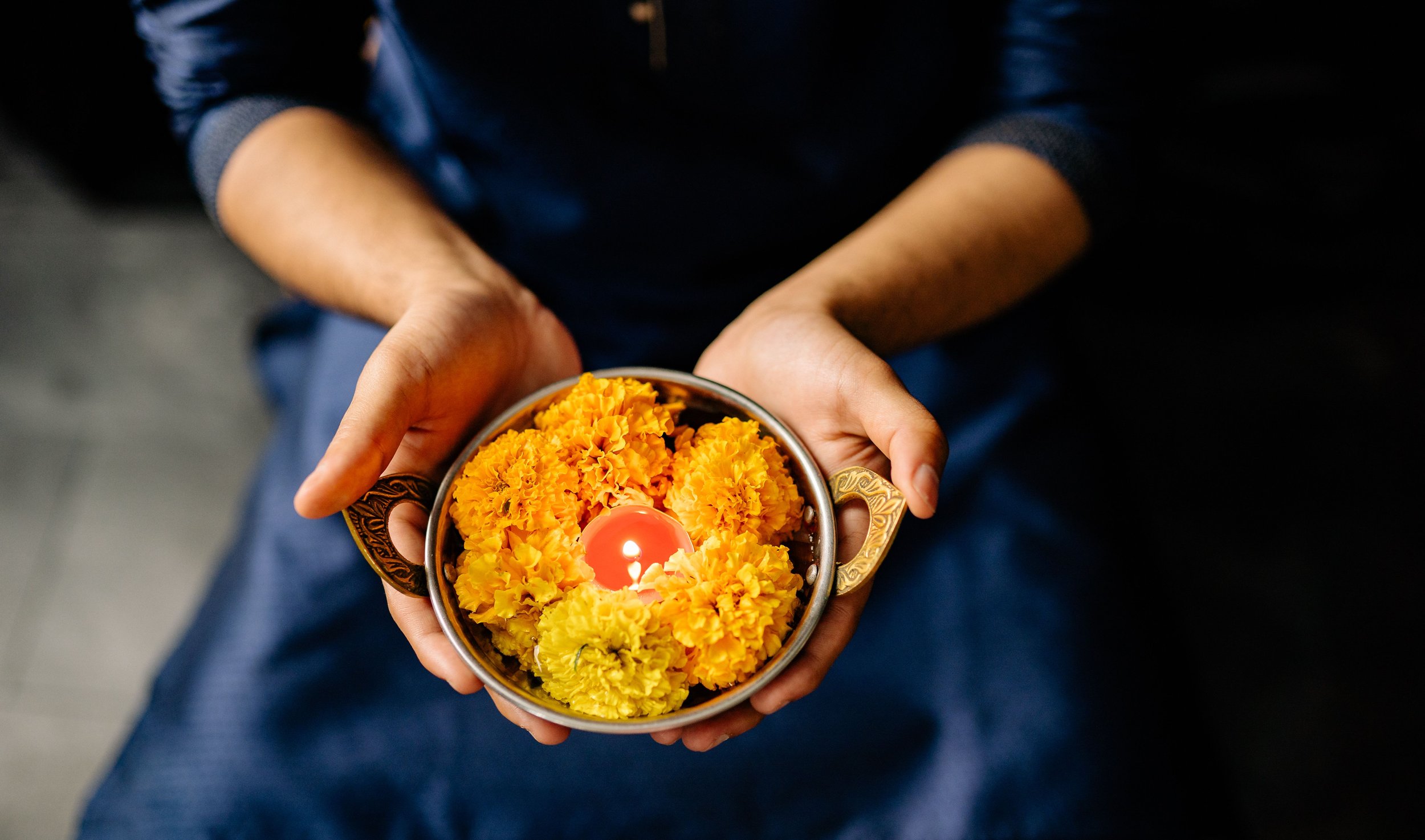 marigolds in hand pexels-yankrukov-8819384.jpg