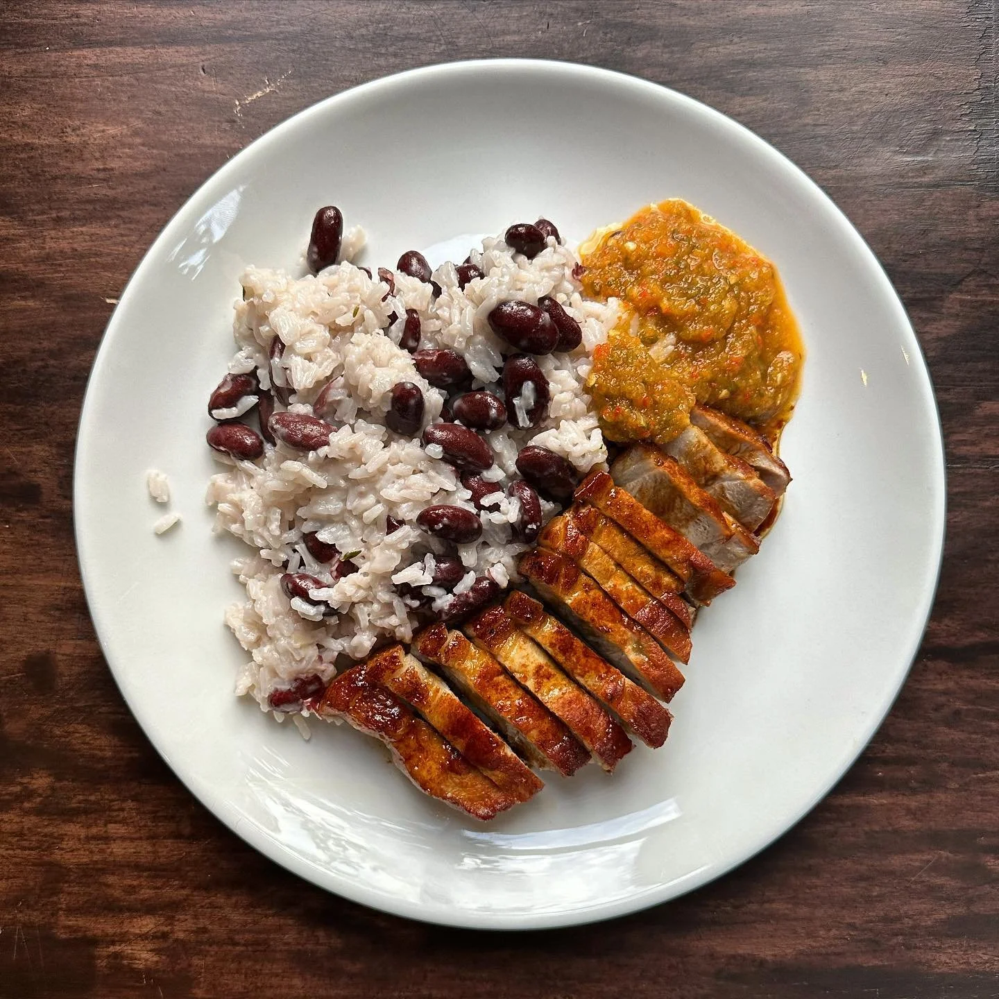 Pork chop, coconut rice&amp;peas, homemade hot pepper chutney.

Monday night with a bang.